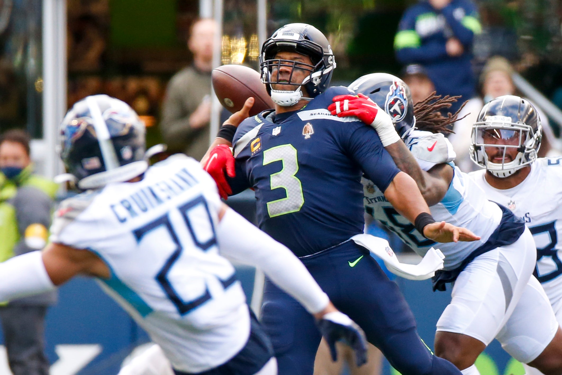 Sep 19, 2021; Seattle, Washington, USA; Seattle Seahawks quarterback Russell Wilson (3) passes under pressure from Tennessee Titans outside linebacker Bud Dupree (48) during the fourth quarter at Lumen Field. Mandatory Credit: Joe Nicholson-USA TODAY Sports