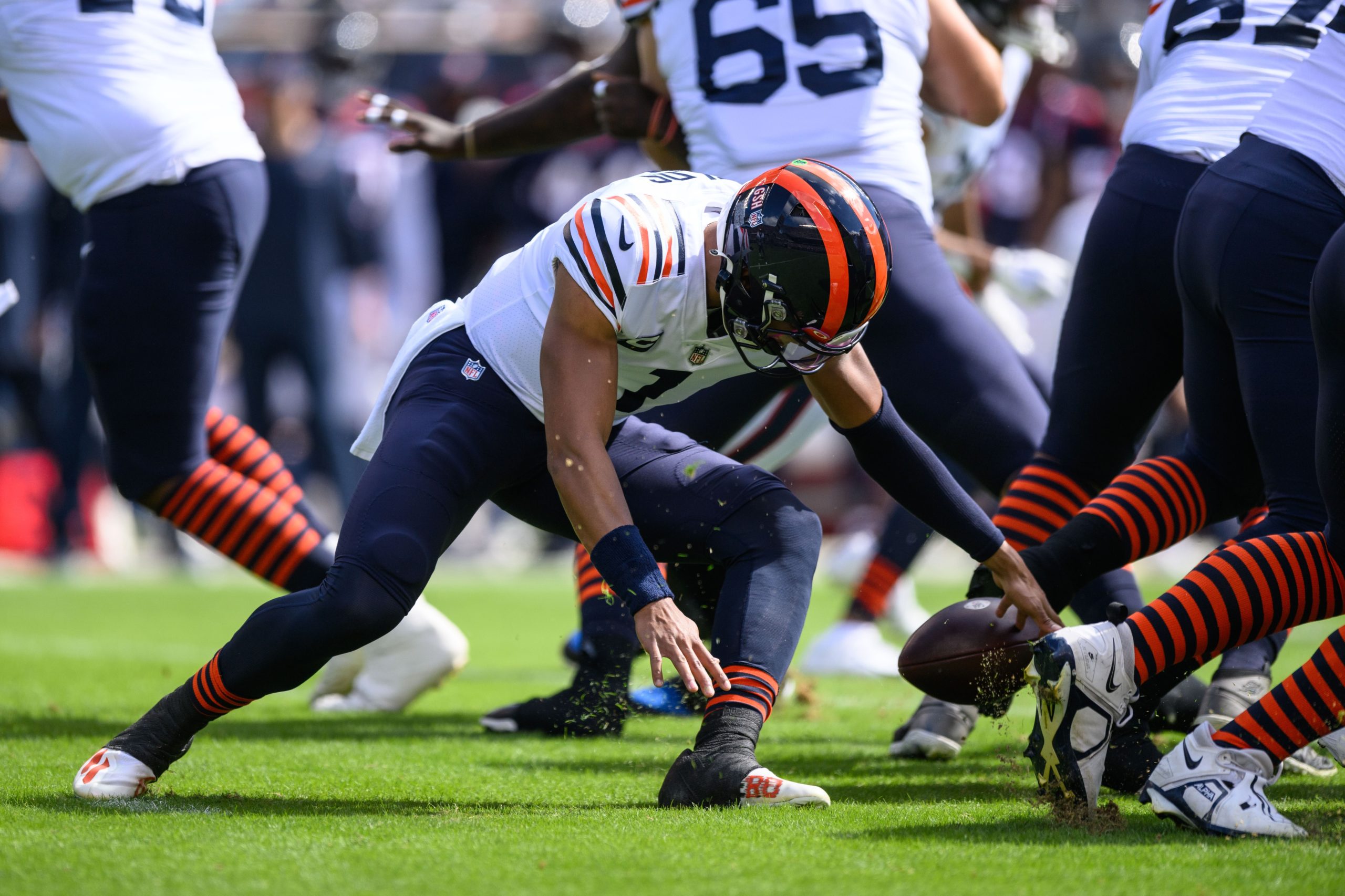 Sep 25, 2022; Chicago, Illinois, USA; Chicago Bears quarterback Justin Fields (1) fumbles the ball in the first quarter against the Houston Texans at Soldier Field. Mandatory Credit: Daniel Bartel-USA TODAY Sports