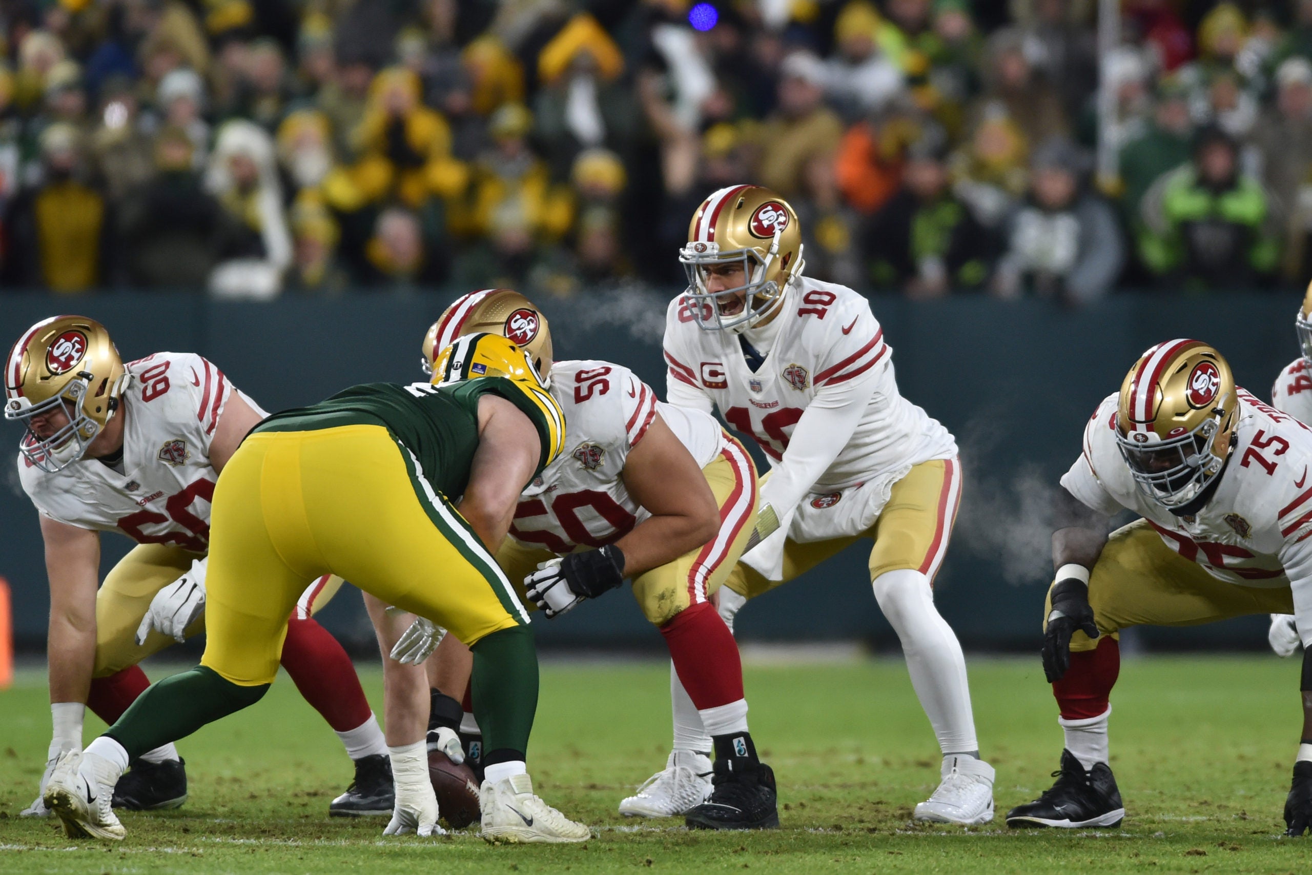 Jan 22, 2022; Green Bay, Wisconsin, USA; San Francisco 49ers quarterback Jimmy Garoppolo (10) in action against the Green Bay Packers during a NFC Divisional playoff football game at Lambeau Field. Mandatory Credit: Jeffrey Becker-USA TODAY Sports