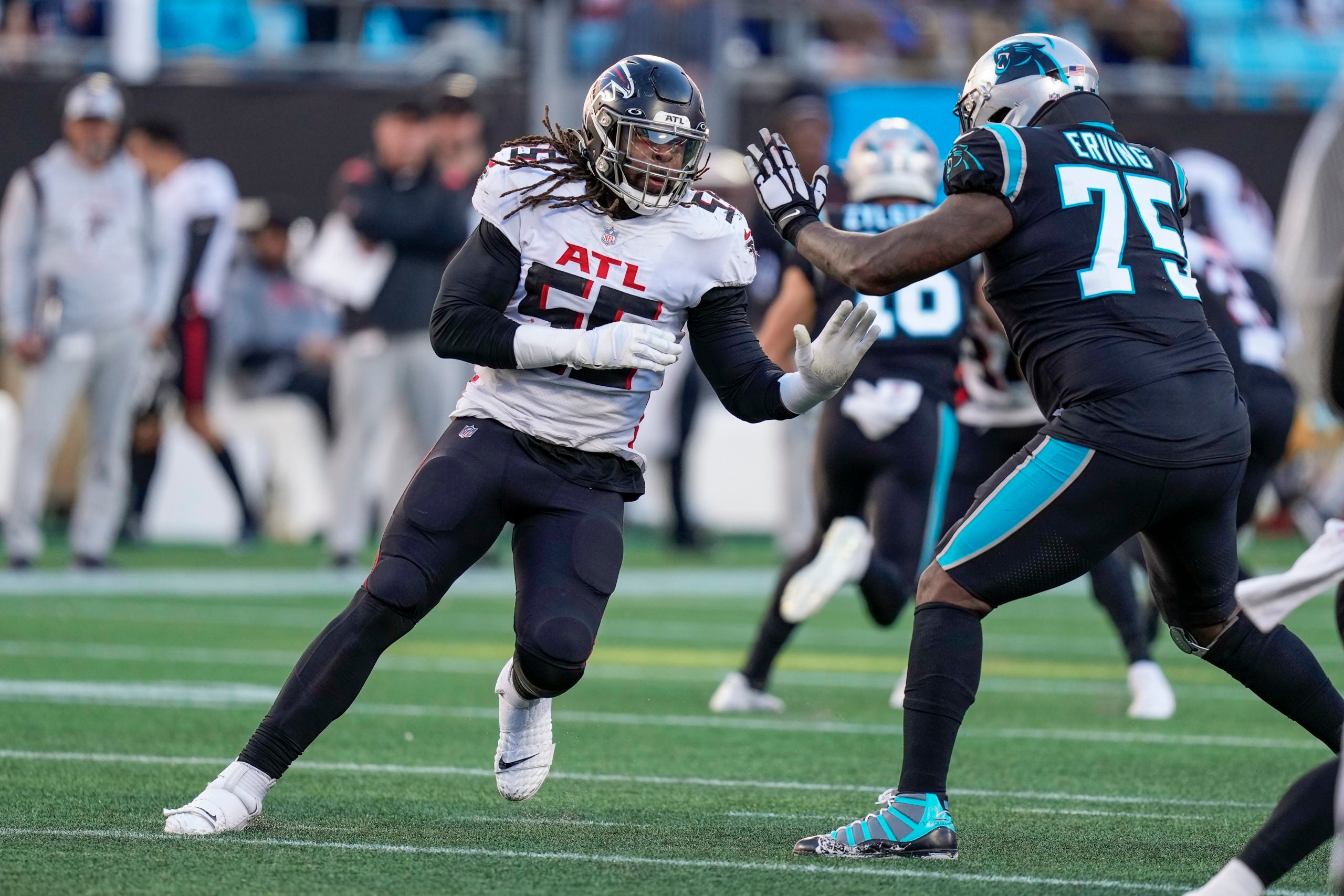 Dec 12, 2021; Charlotte, North Carolina, USA: Atlanta Falcons linebacker Steven Means (55) works around end against Carolina Panthers offensive tackle Cameron Erving (75) during the second half at Bank of America Stadium. Mandatory Credit: Jim Dedmon-USA TODAY Sports