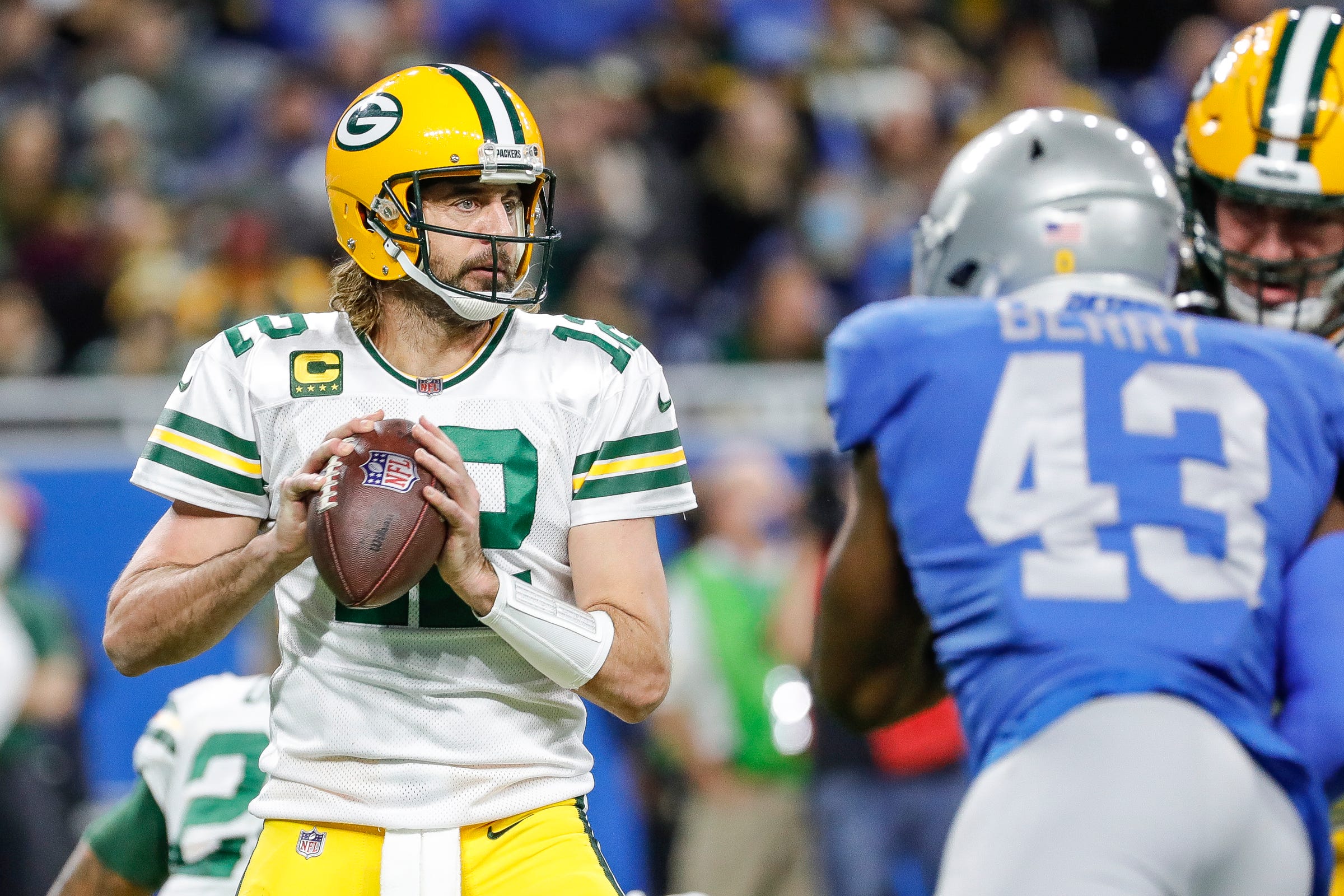 Packers quarterback Aaron Rodgers looks to make a pass against the Lions during the first half on Sunday, Jan. 9, 2022, at Ford Field.