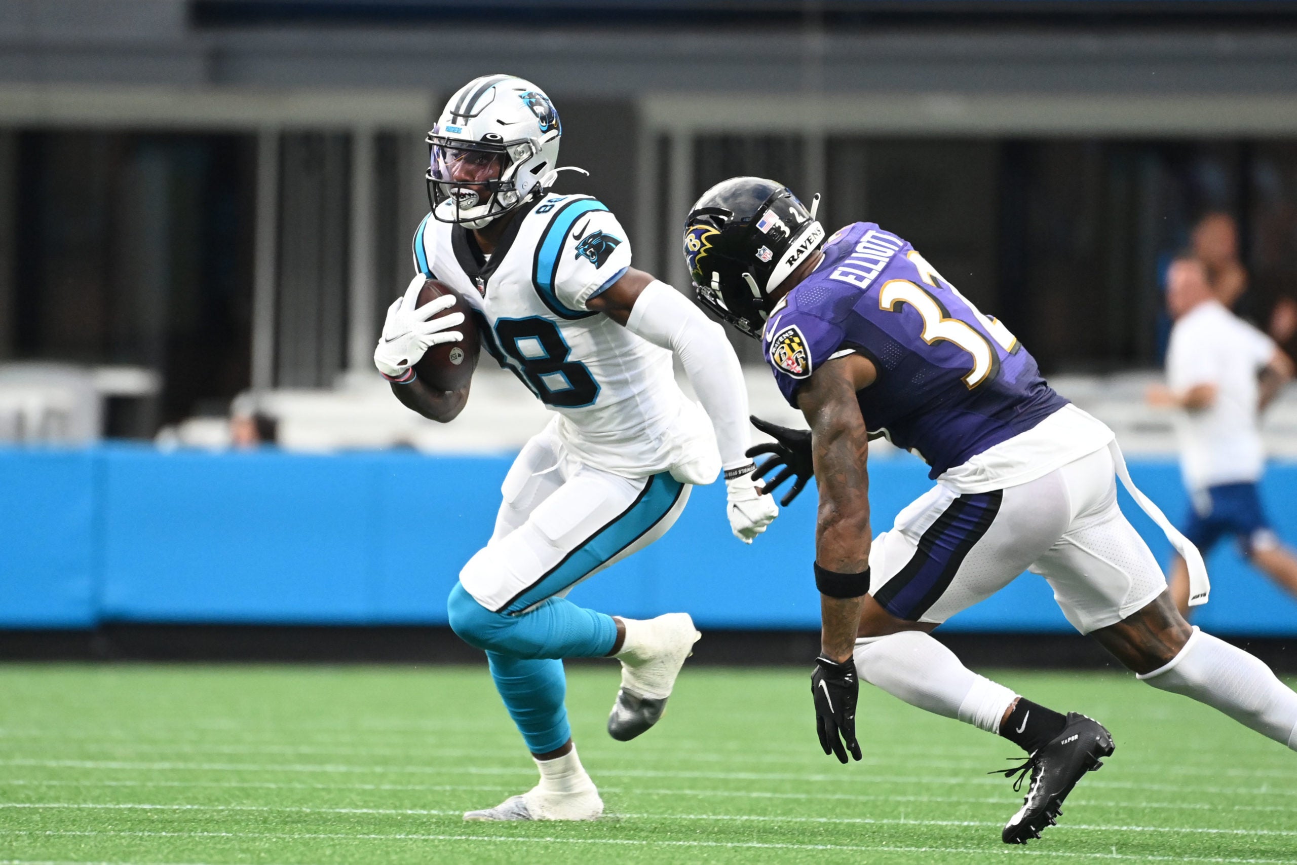 Aug 21, 2021; Charlotte, North Carolina, USA; Carolina Panthers wide receiver Terrace Marshall Jr. (88) with the ball as Baltimore Ravens defensive back DeShon Elliott (32) defends in the first quarter at Bank of America Stadium. Mandatory Credit: Bob Donnan-USA TODAY Sports