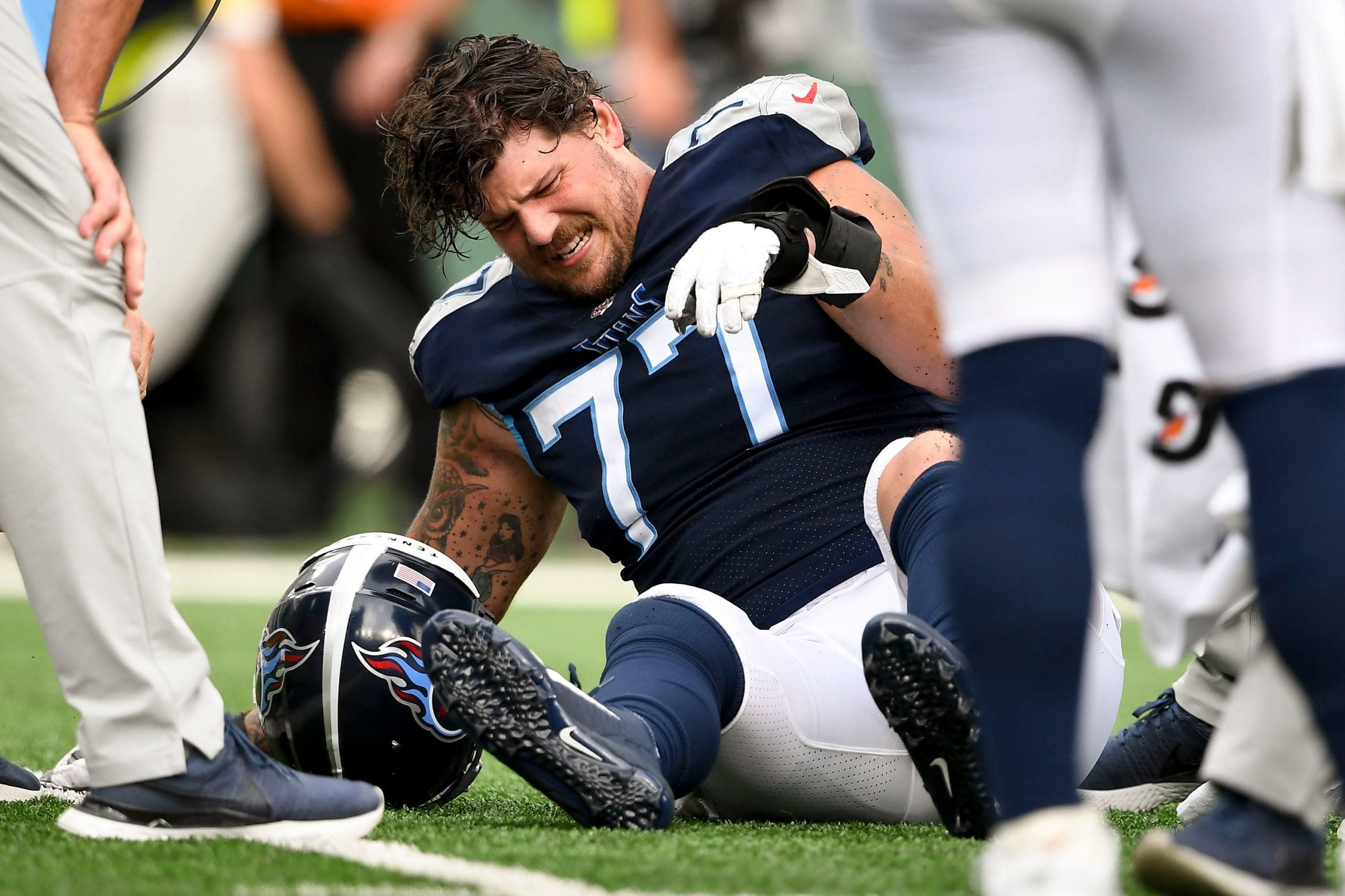 Tennessee Titans offensive tackle Taylor Lewan (77) is injured while playing the Jets during the fourth quarter at MetLife Stadium Sunday, Oct. 3, 2021 in East Rutherford, N.J. Titans Jets 132