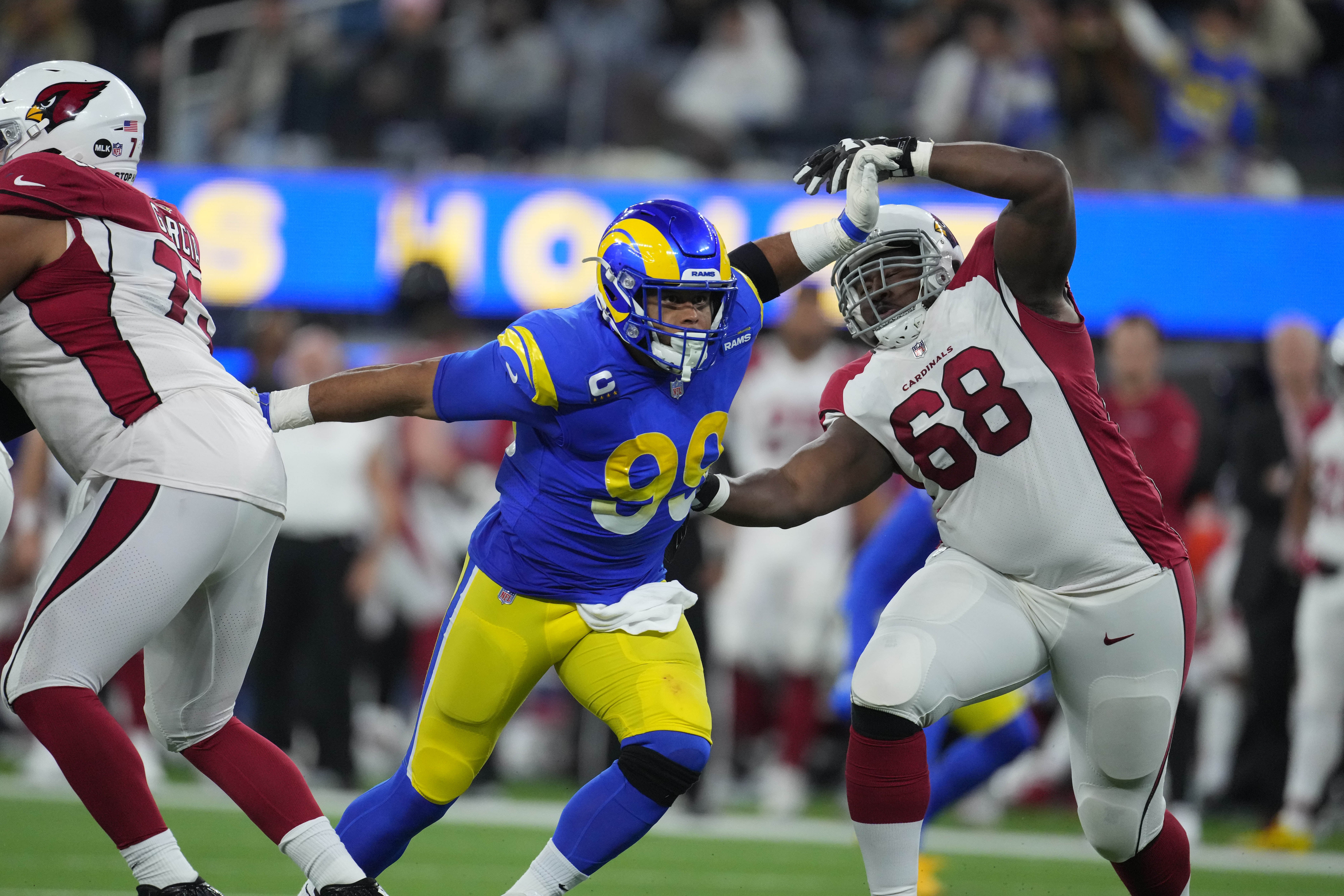 Jan 17, 2022; Inglewood, California, USA; Los Angeles Rams defensive end Aaron Donald (99) rushes past Arizona Cardinals offensive tackle Kelvin Beachum (68) during the second half of an NFC Wild Card playoff football game at SoFi Stadium. The Rams defeated the Cardinals 34-11. Mandatory Credit: Kirby Lee-USA TODAY Sports
