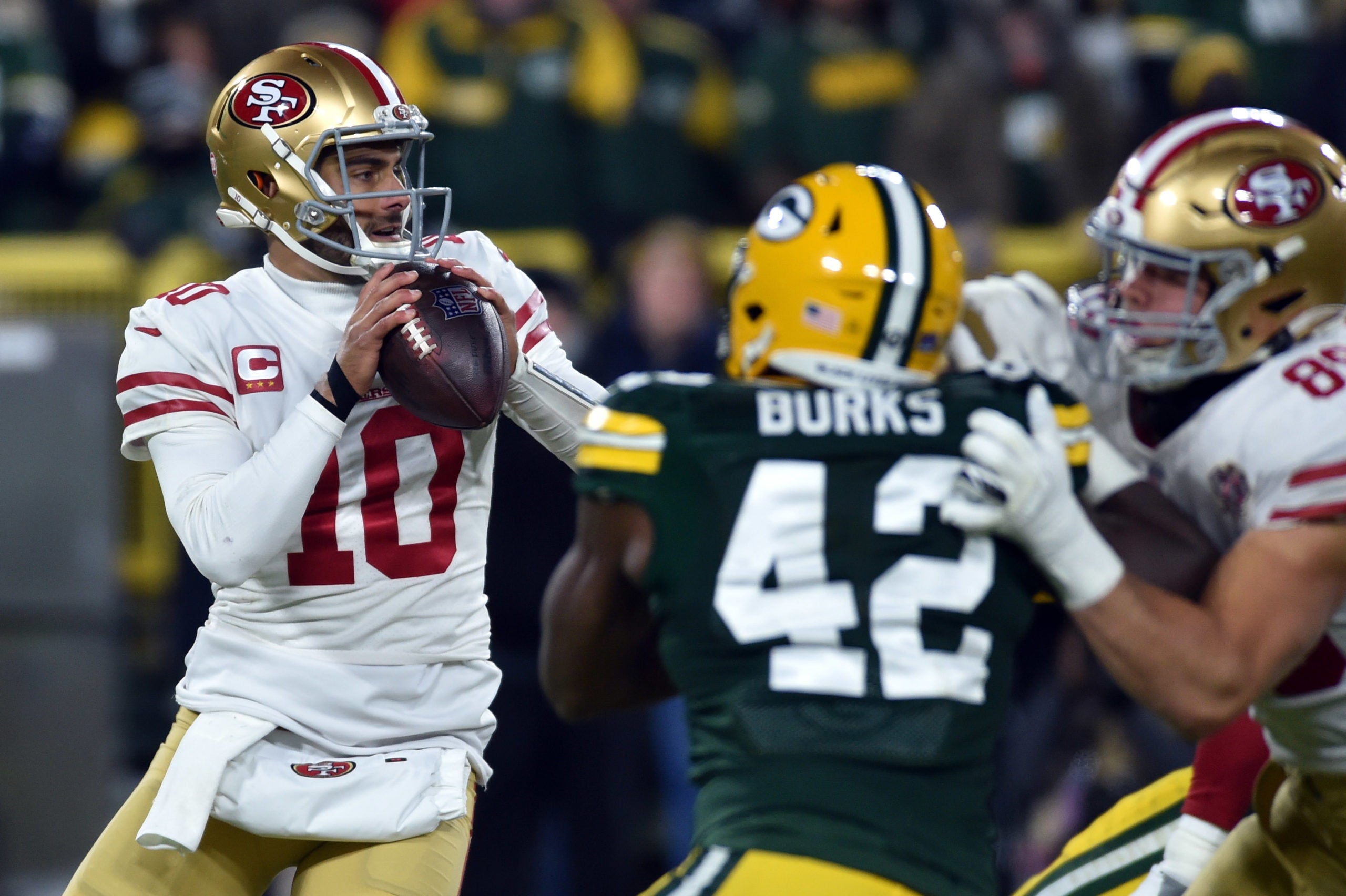 Jan 22, 2022; Green Bay, Wisconsin, USA; San Francisco 49ers quarterback Jimmy Garoppolo (10) throws the ball during the second quarter against the Green Bay Packers during a NFC Divisional playoff football game at Lambeau Field. Mandatory Credit: Jeffrey Becker-USA TODAY Sports