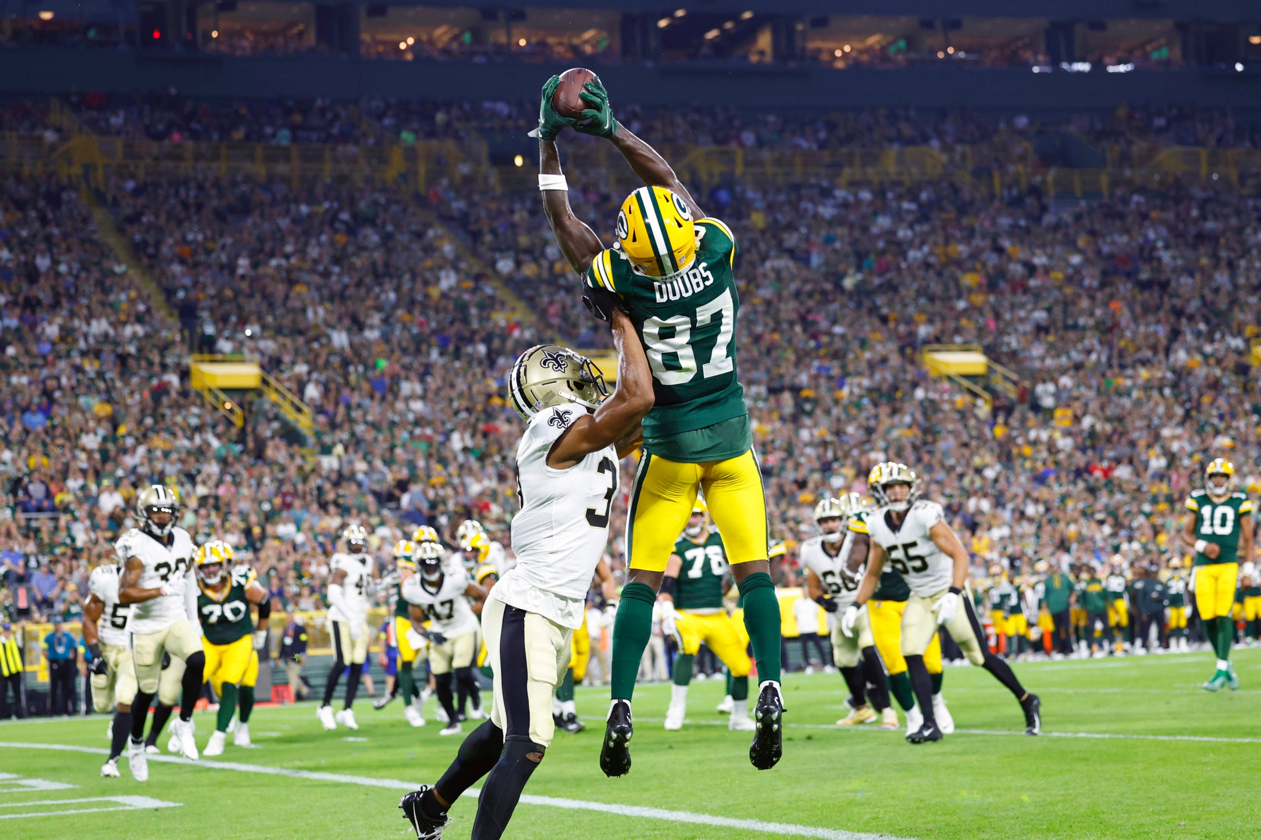 Aug 19, 2022; Green Bay, Wisconsin, USA;  Green Bay Packers wide receiver Romeo Doubs (87) catches a pass to score a touchdown during the second quarter against the New Orleans Saints at Lambeau Field. Mandatory Credit: Jeff Hanisch-USA TODAY Sports
