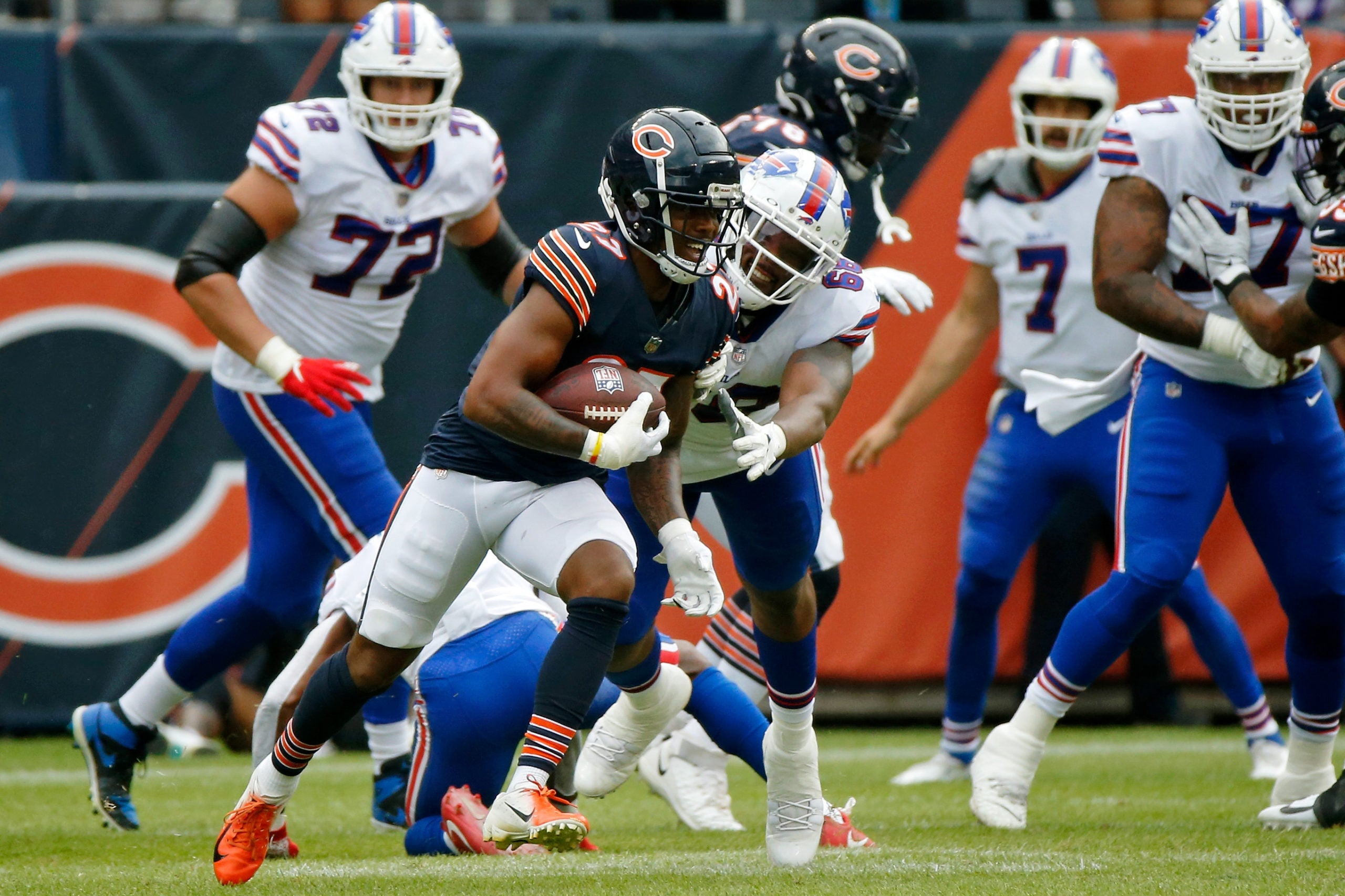 Aug 21, 2021; Chicago, Illinois, USA; Chicago Bears cornerback Thomas Graham Jr. (27) evades the tackle of Buffalo Bills offensive tackle Bobby Hart (68) during the second half at Soldier Field. The Buffalo Bills won 41-15. Mandatory Credit: Jon Durr-USA TODAY Sports