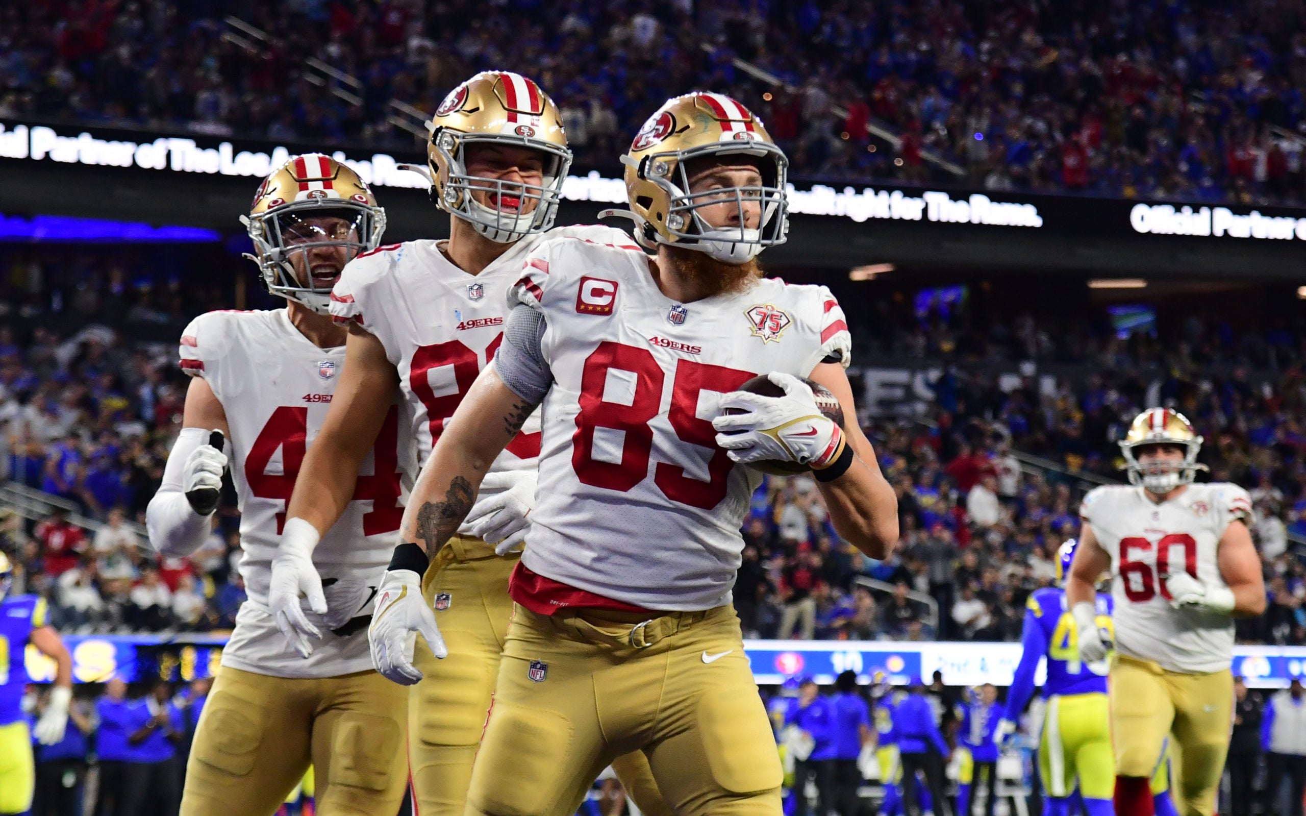 Jan 30, 2022; Inglewood, California, USA; San Francisco 49ers tight end George Kittle (85) celebrates with teammates after scoring a touchdown against the Los Angeles Rams in the second half during the NFC Championship Game at SoFi Stadium. Mandatory Credit: Gary A. Vasquez-USA TODAY Sports