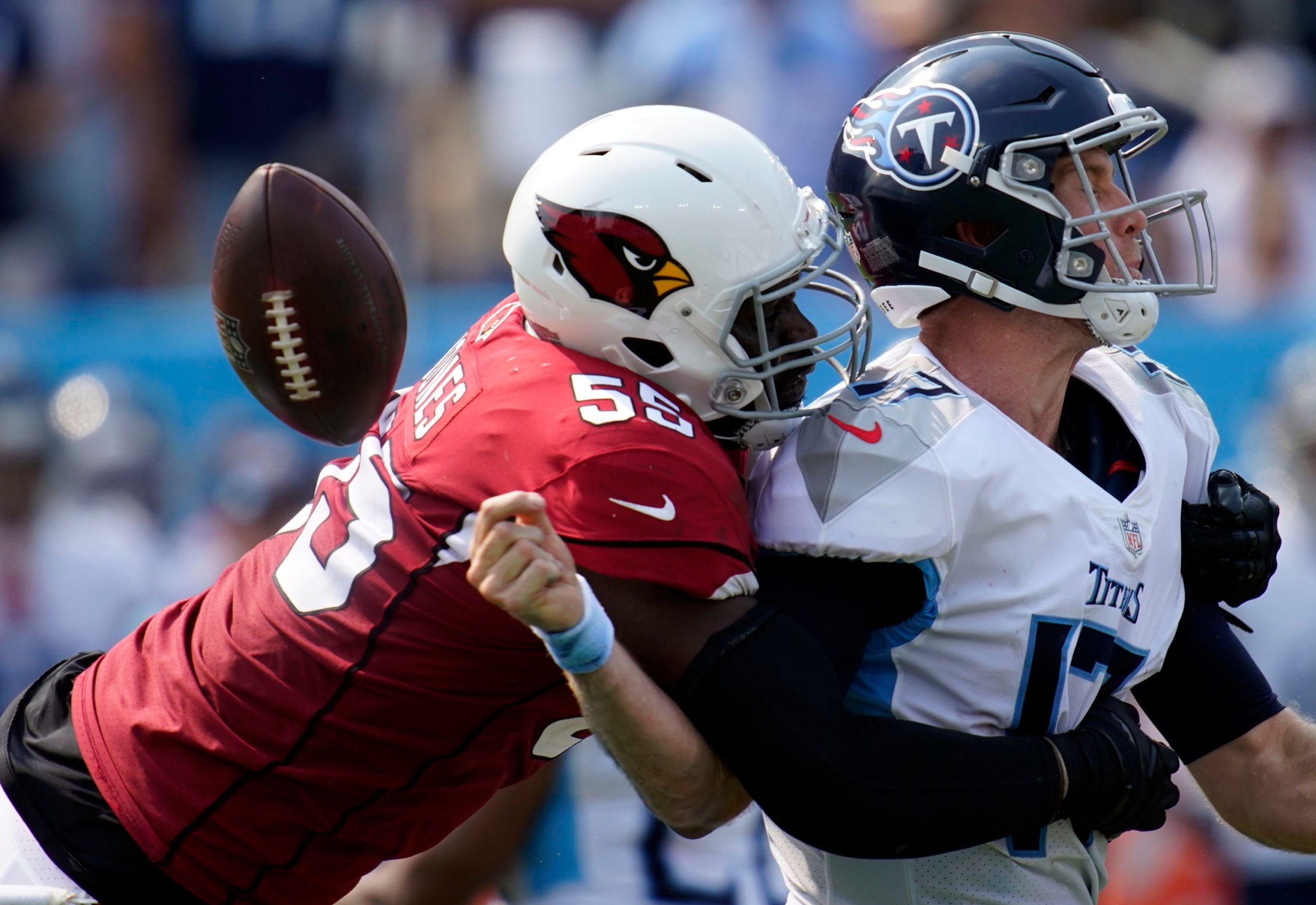 Tennessee Titans quarterback Ryan Tannehill (17) is sacked by Arizona Cardinals linebacker Chandler Jones (55) during the third quarter at Nissan Stadium Sunday, Sept. 12, 2021 in Nashville, Tenn. Titans Cards 194