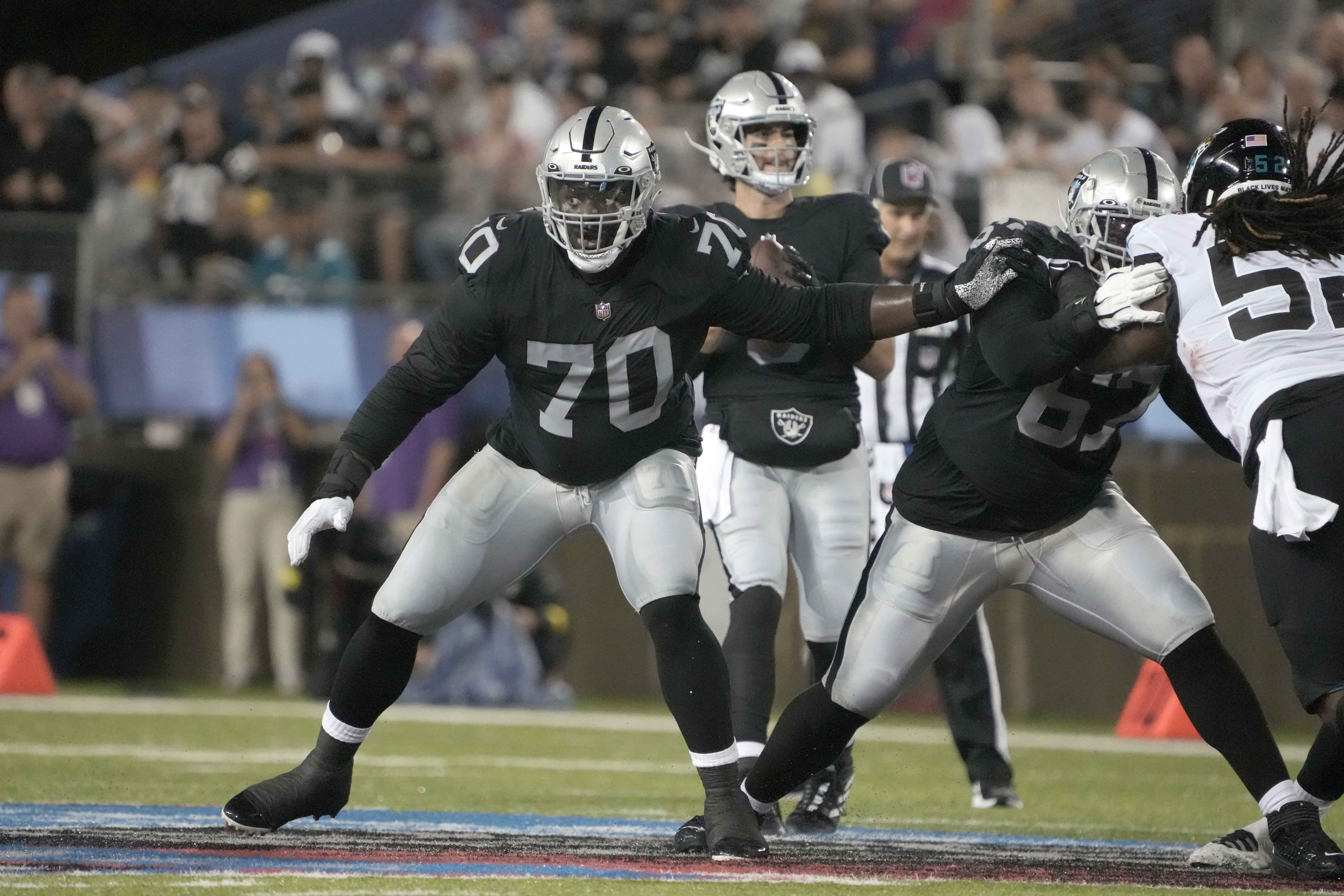 Aug 4, 2022; Canton, Ohio, USA; Las Vegas Raiders offensive tackle Alex Leatherwood (70) against the Jacksonville Jaguars in the Pro Football Hall of Fame game at Tom Benson Hall of Fame Stadium. Mandatory Credit: Kirby Lee-USA TODAY Sports