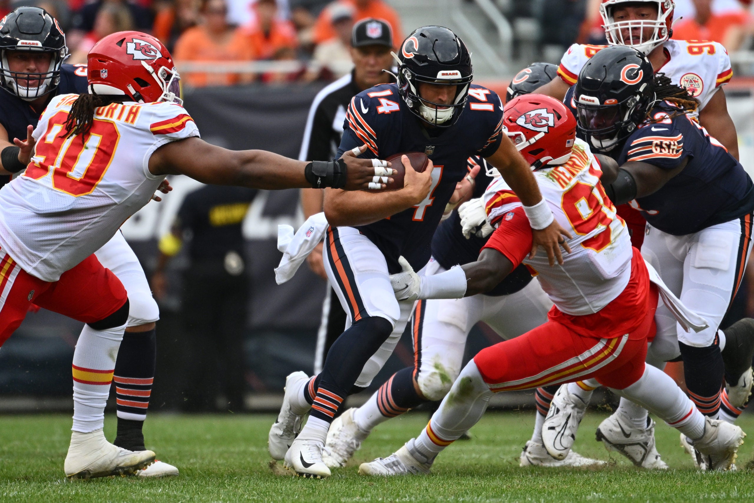 Aug 13, 2022; Chicago, Illinois, USA;  Chicago Bears quarterback Nathan Peterman (14) gains yardage in the third quarter as Kansas City Chiefs defensive tackle Taylor Stallworth (90) and defensive end Malik Herring (94) move in for the tackle at Soldier Field. Chicago defeated Kansas City 19-14.  Mandatory Credit: Jamie Sabau-USA TODAY Sports