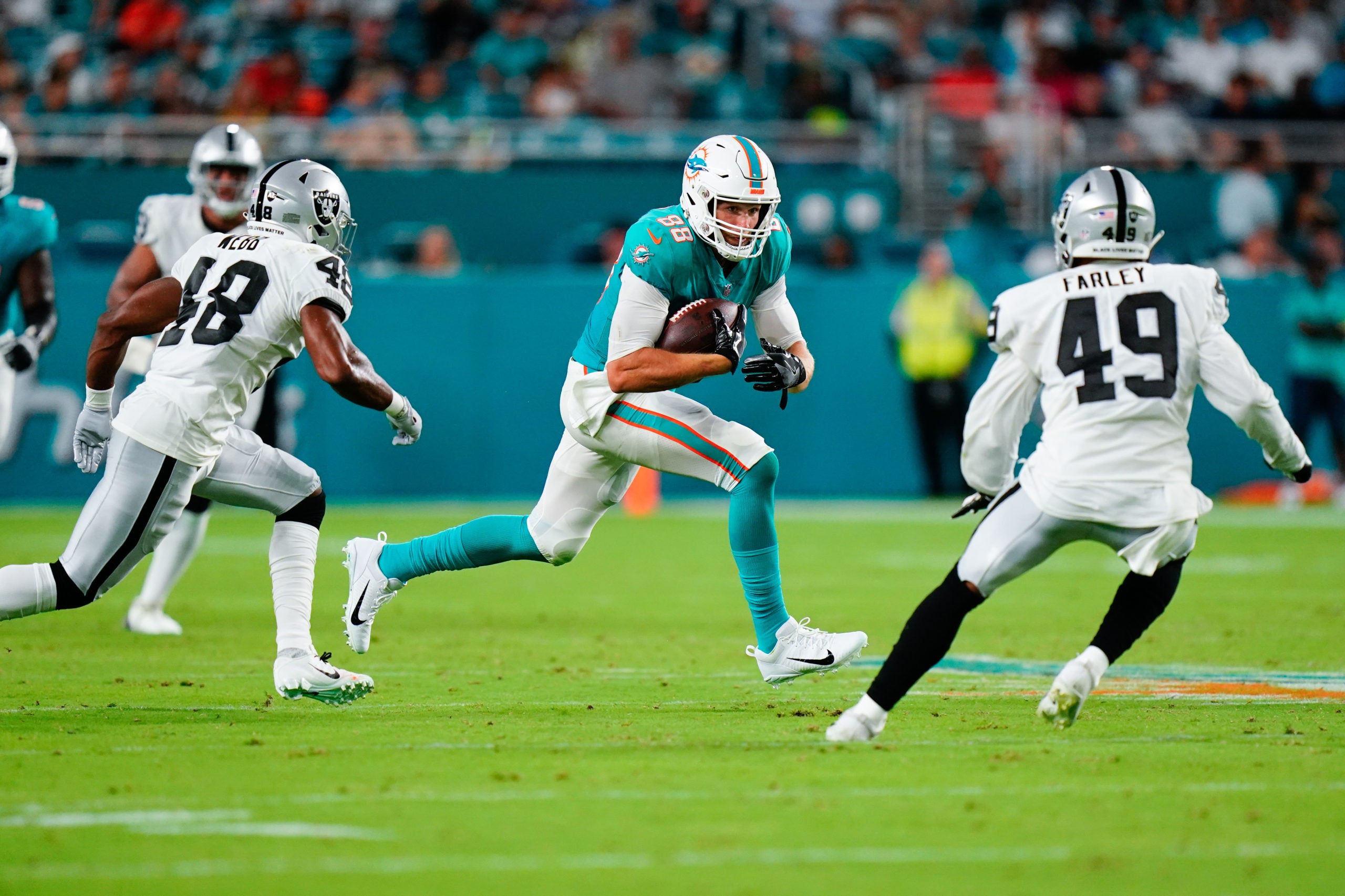Aug 20, 2022; Miami Gardens, Florida, USA; Miami Dolphins tight end Mike Gesicki (88) runs against the Las Vegas Raiders during the second quarter at Hard Rock Stadium. Mandatory Credit: Rich Storry-USA TODAY Sports
