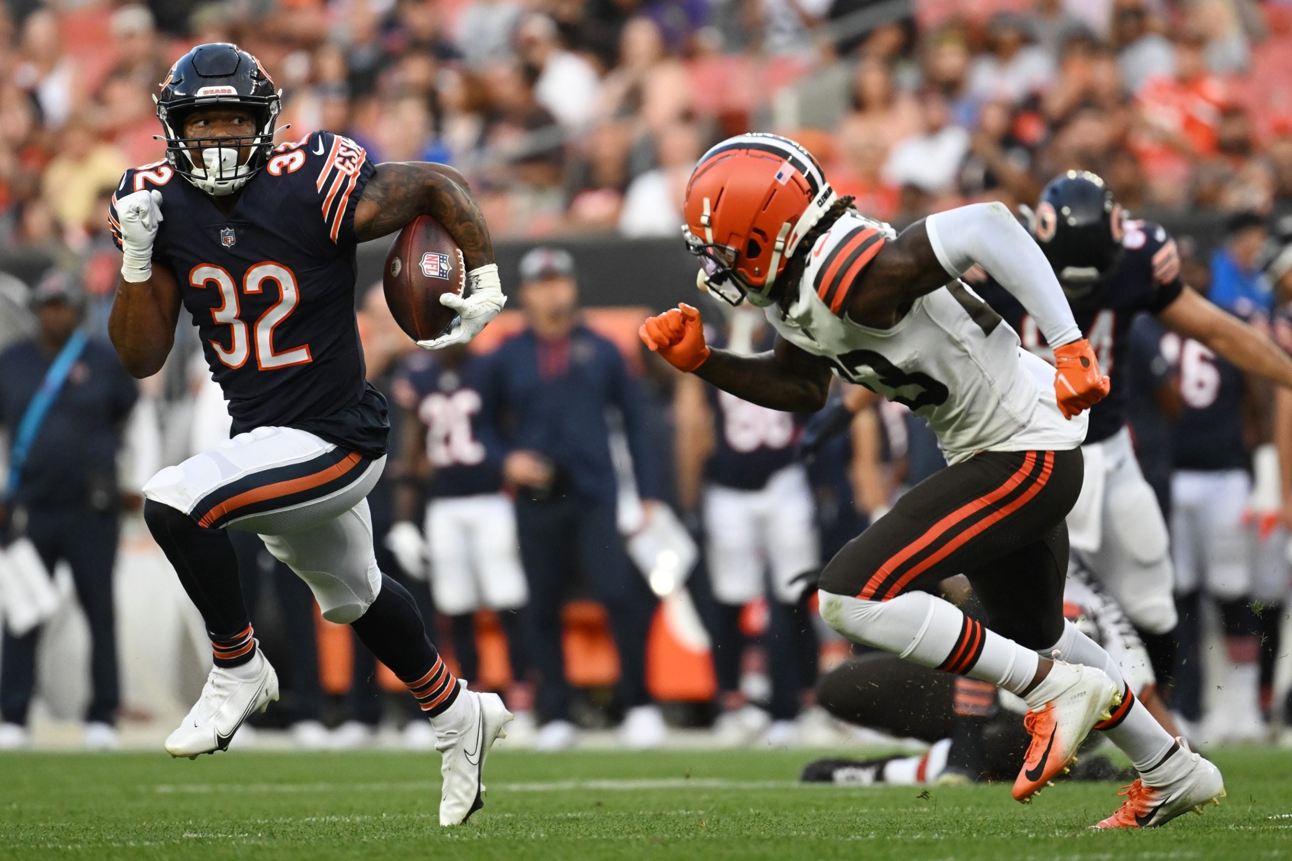 Aug 27, 2022; Cleveland, Ohio, USA; Chicago Bears running back David Montgomery (32) runs with the ball as Cleveland Browns cornerback Martin Emerson Jr. (23) defends during the first half at FirstEnergy Stadium. Mandatory Credit: Ken Blaze-USA TODAY Sports