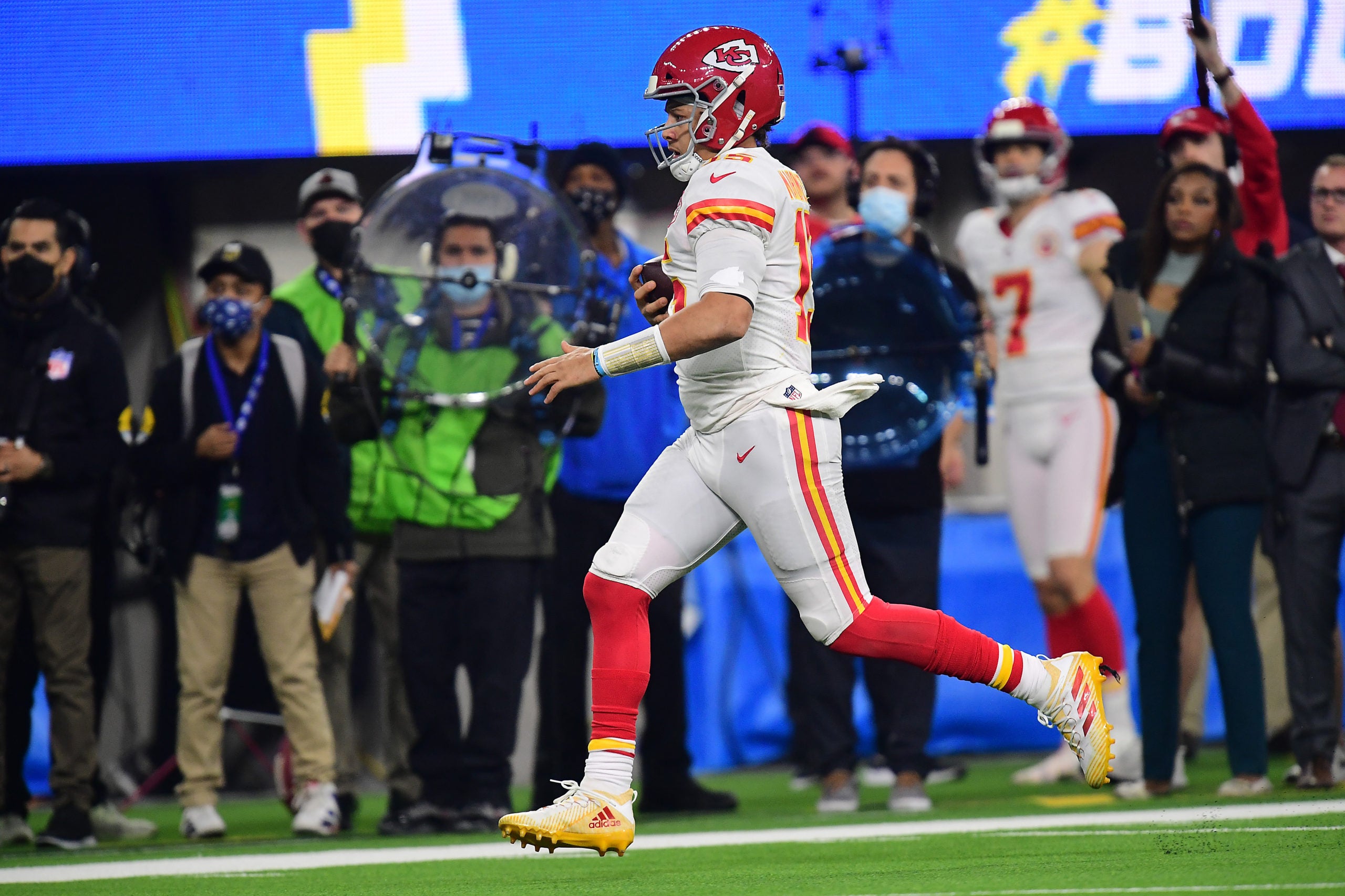 Dec 16, 2021; Inglewood, California, USA; Kansas City Chiefs quarterback Patrick Mahomes (15) runs the ball for first down against the Los Angeles Chargers during the second half at SoFi Stadium. Mandatory Credit: Gary A. Vasquez-USA TODAY Sports