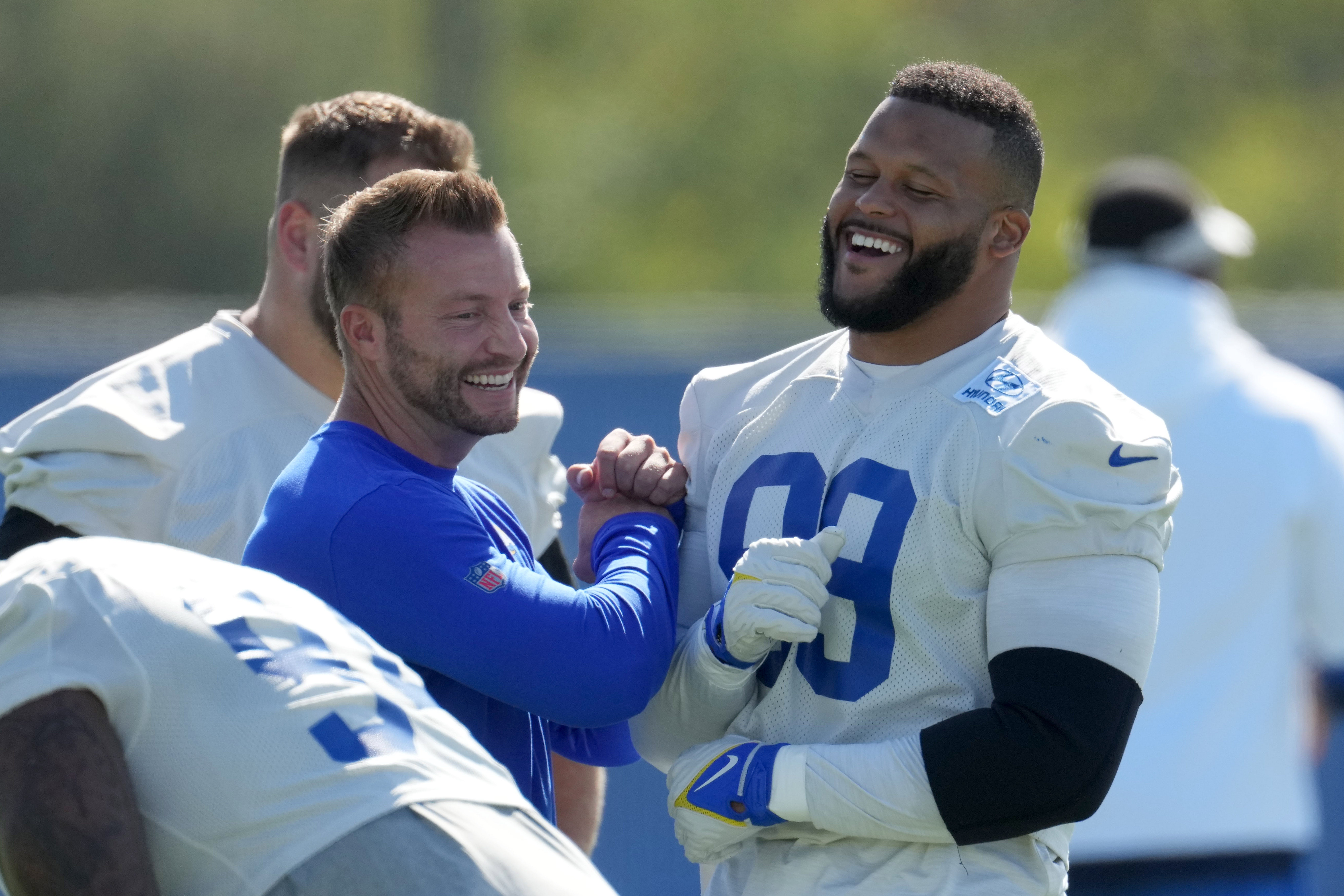 Jun 7, 2022; Thousand Oaks, California, USA; Los Angeles Rams defensive end Aaron Donald (99) and coach Sean McVay react during minicamp at Cal Lutheran University. Mandatory Credit: Kirby Lee-USA TODAY Sports