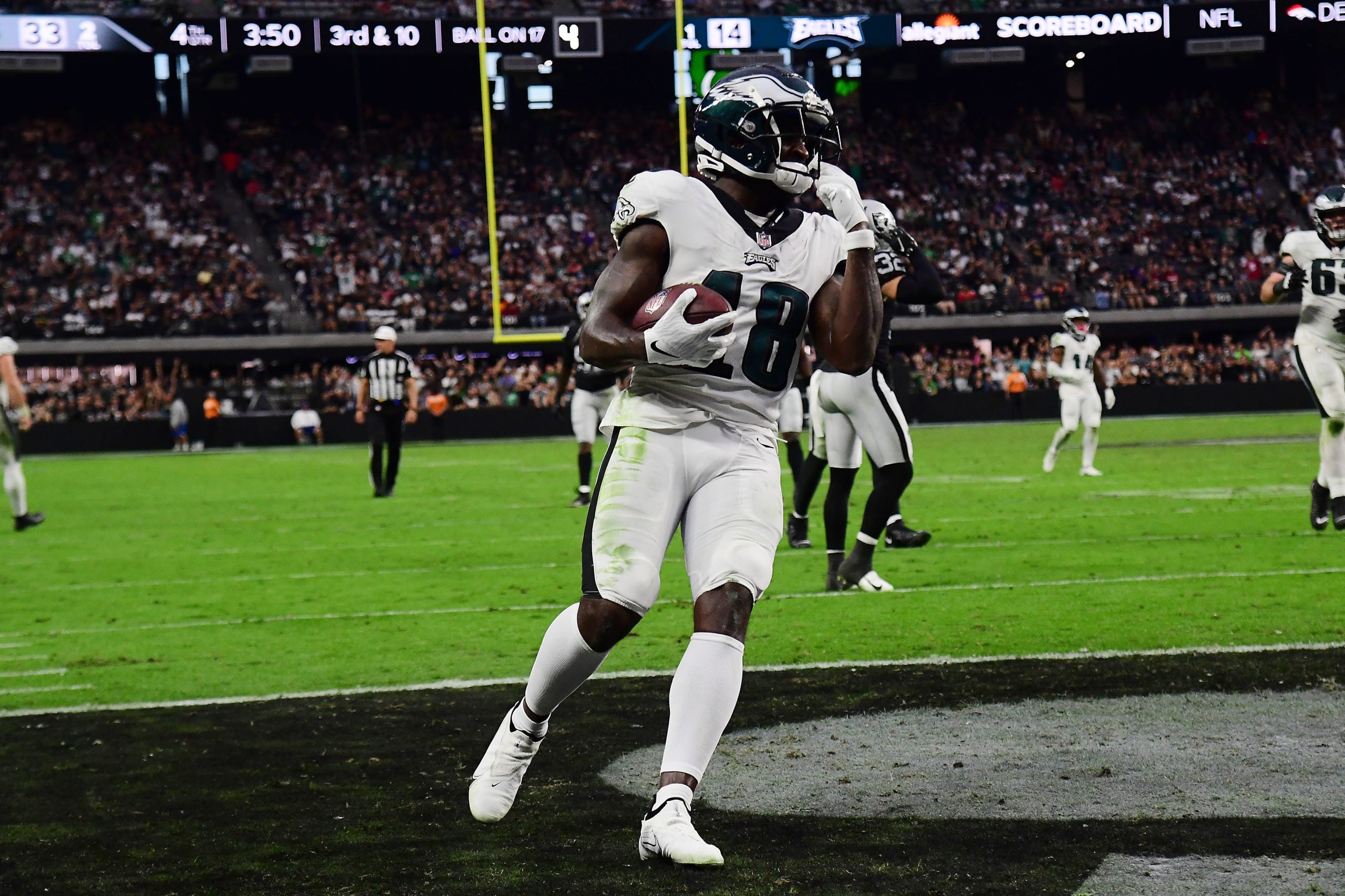 Oct 24, 2021; Paradise, Nevada, USA; Philadelphia Eagles wide receiver Jalen Reagor (18) scores a touchdown against the Las Vegas Raiders during the second half at Allegiant Stadium. Mandatory Credit: Gary A. Vasquez-USA TODAY Sports