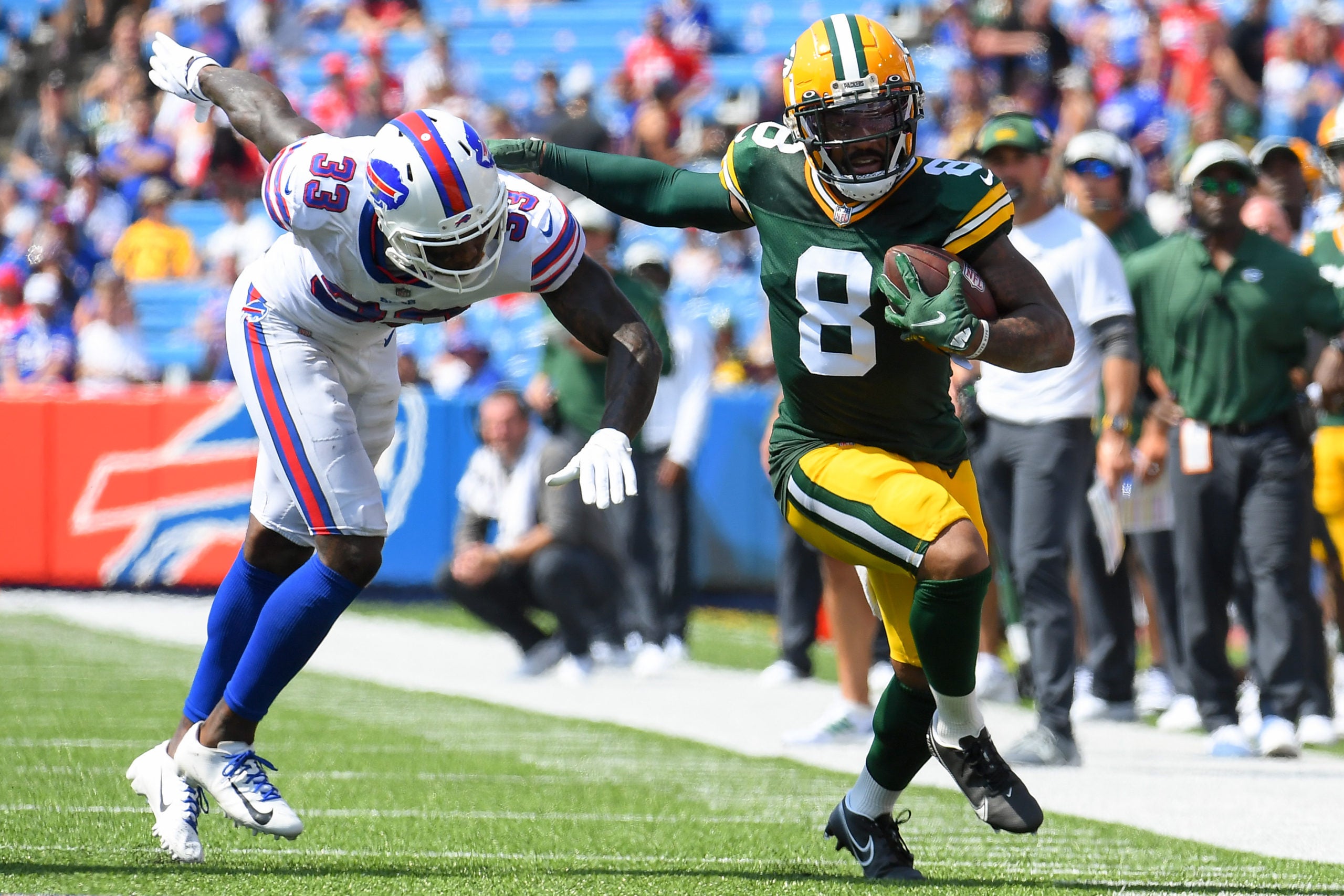 Aug 28, 2021; Orchard Park, New York, USA; Green Bay Packers wide receiver Amari Rodgers (8) runs with the ball after a catch as Buffalo Bills defensive back Siran Neal (33) defends during the second quarter at Highmark Stadium. Mandatory Credit: Rich Barnes-USA TODAY Sports
