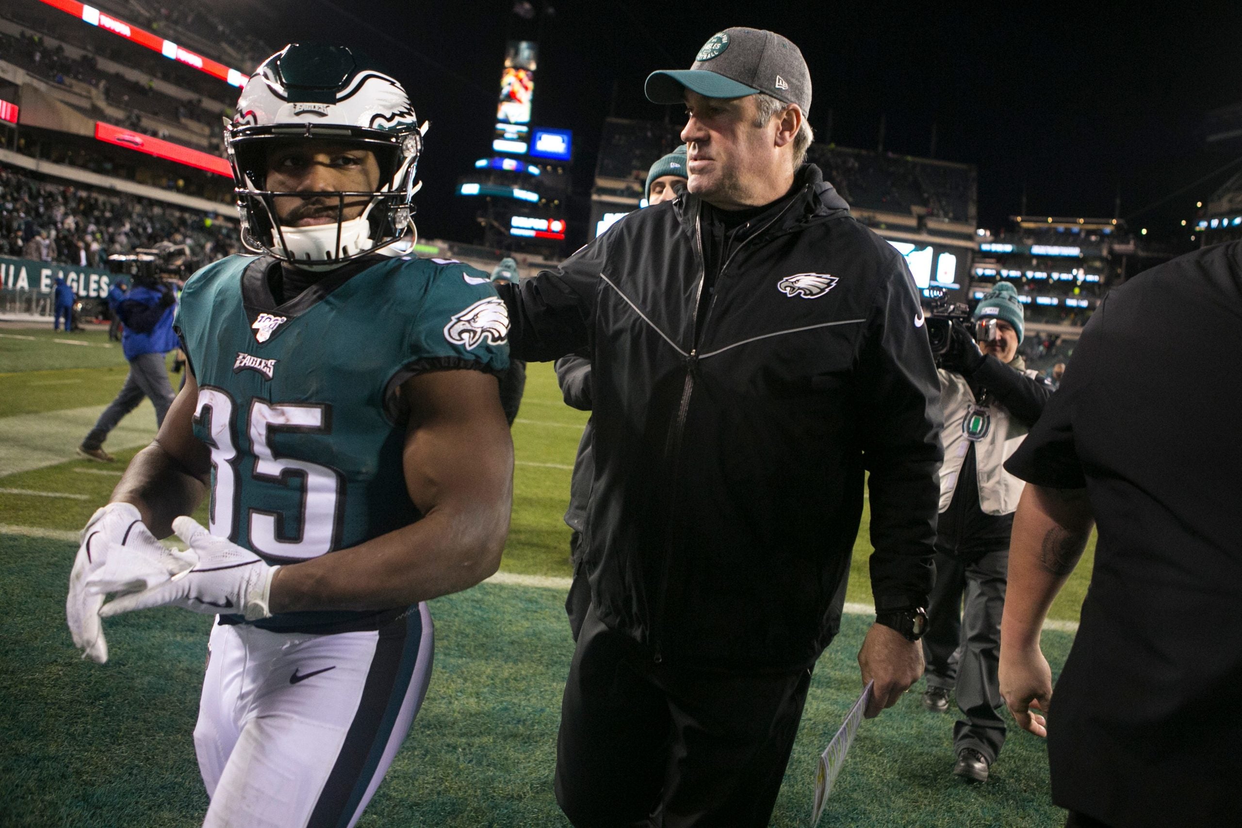 Eagles head coach Doug Pederson, right, puts his arm around running back Boston Scott (35) after losing to the Seattle Seahawks 17-9 Sunday night at Lincoln Financial Field. Sports Eagles Seahawks