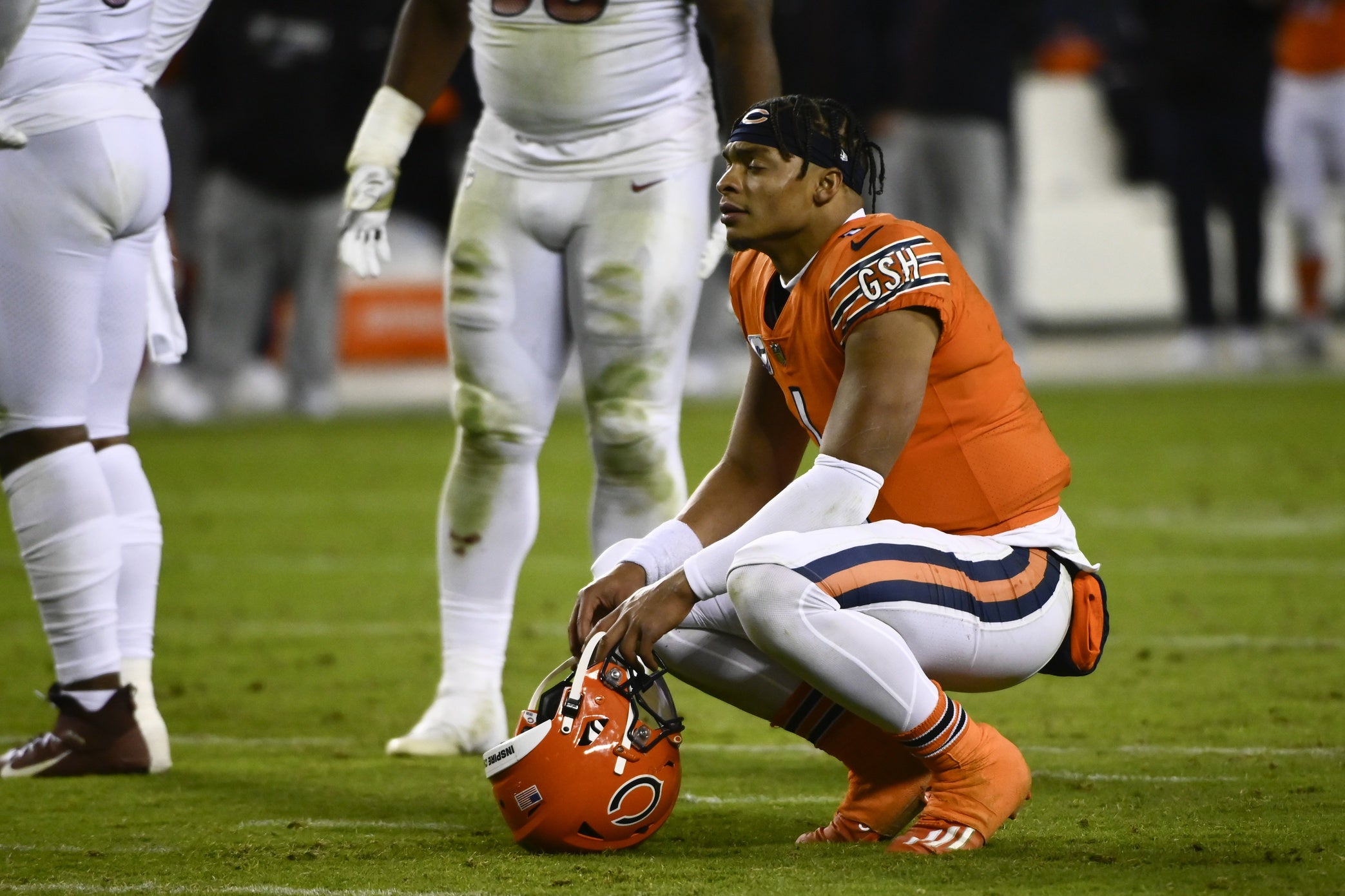 Oct 13, 2022; Chicago, Illinois, USA; Chicago Bears quarterback Justin Fields (1) looks on after turning the ball over on downs in the fourth quarter against the Washington Commanders at Soldier Field. Mandatory Credit: Matt Marton-USA TODAY Sports