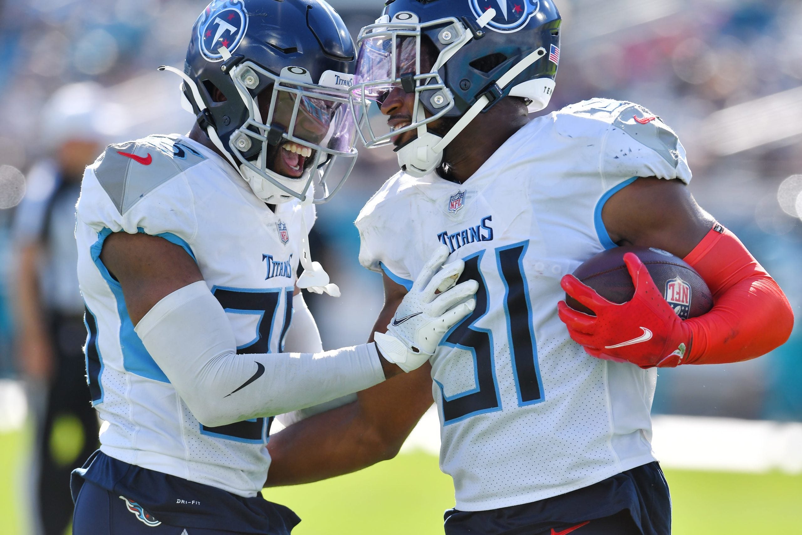 Tennessee Titans cornerback Chris Jackson (35) celebrates with teammate Tennessee Titans safety Kevin Byard (31) after he intercepted a pass from Jacksonville Jaguars quarterback Trevor Lawrence (16) to end Sunday's game. The Jacksonville Jaguars hosted the Tennessee Titans at TIAA Bank Field in Jacksonville, Florida, October 10, 2021.  The Jaguars trailed at the half 24 to 13 and lost with a final score of 37-19. [Bob Self/Florida Times-Union] Jki 101021 Jaguarsvstitans 37