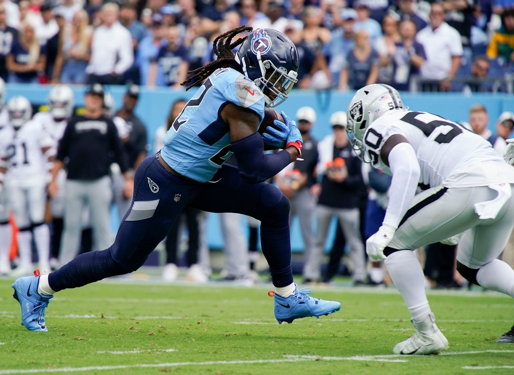 Tennessee Titans running back Derrick Henry (22) tries to get past Las Vegas Raiders linebacker Jayon Brown (50) during the first quarter at Nissan Stadium Sunday, Sept. 25, 2022, in Nashville, Tenn. Mandatory Credit: George Walker/The Tennesseean