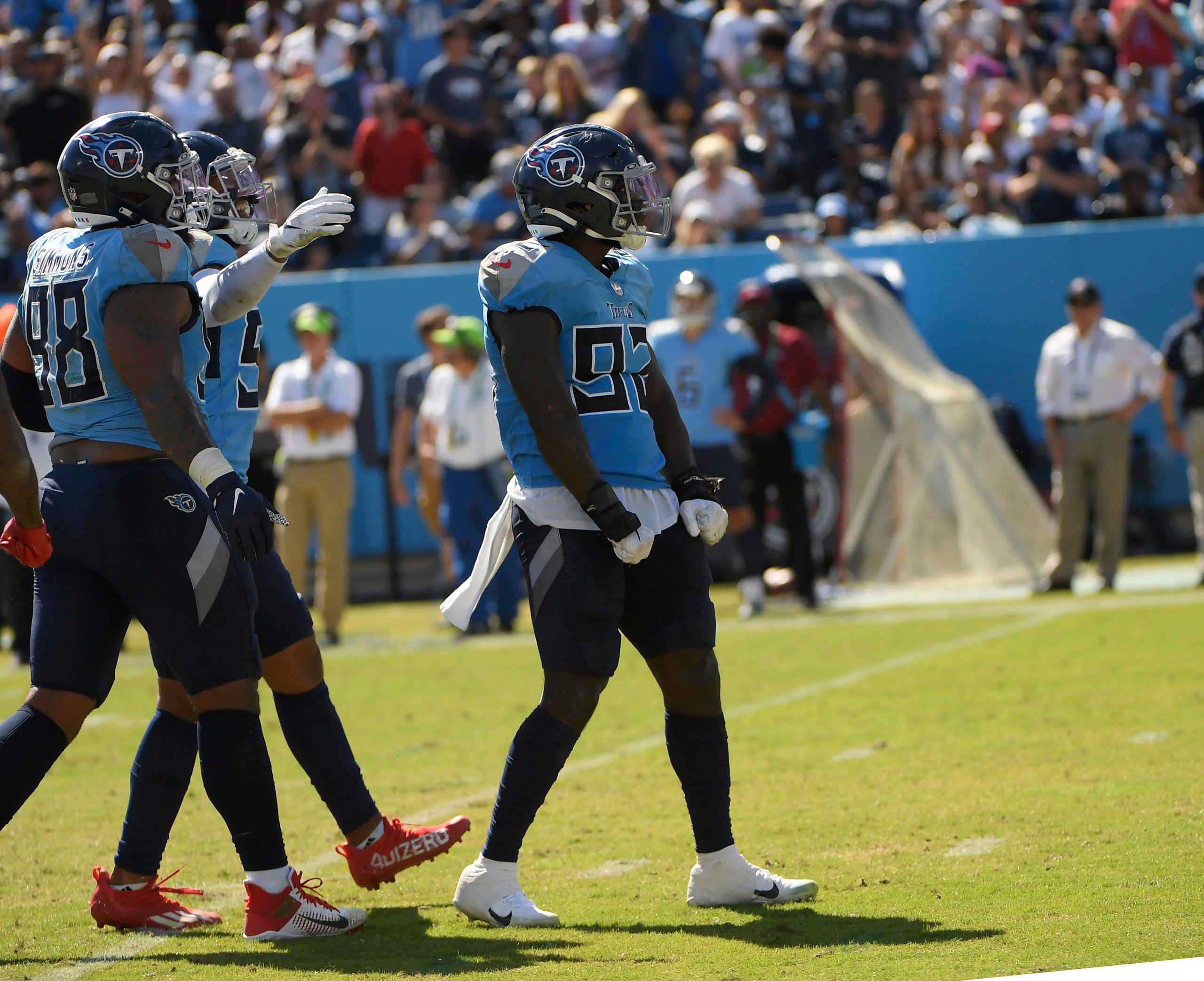 Sep 26, 2021; Nashville, Tennessee, USA;  Tennessee Titans linebacker Ola Adeniyi (92) celebrates a sack against the Indianapolis Colts during the second half at Nissan Stadium. Mandatory Credit: Steve Roberts-USA TODAY Sports