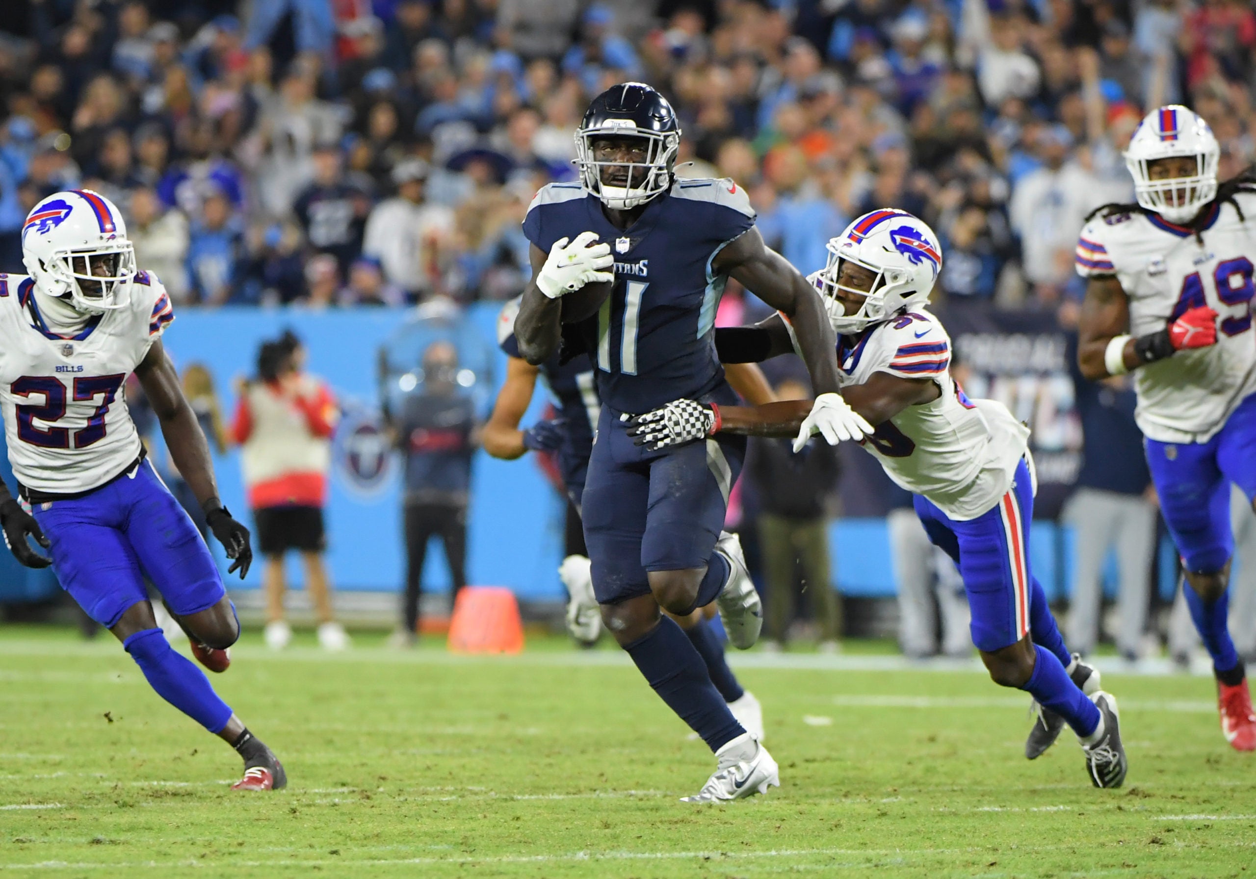 Oct 18, 2021; Nashville, Tennessee, USA; Tennessee Titans wide receiver A.J. Brown (11) and Buffalo Bills safety Damar Hamlin (31) during the second half at Nissan Stadium. Mandatory Credit: Steve Roberts-USA TODAY Sports
