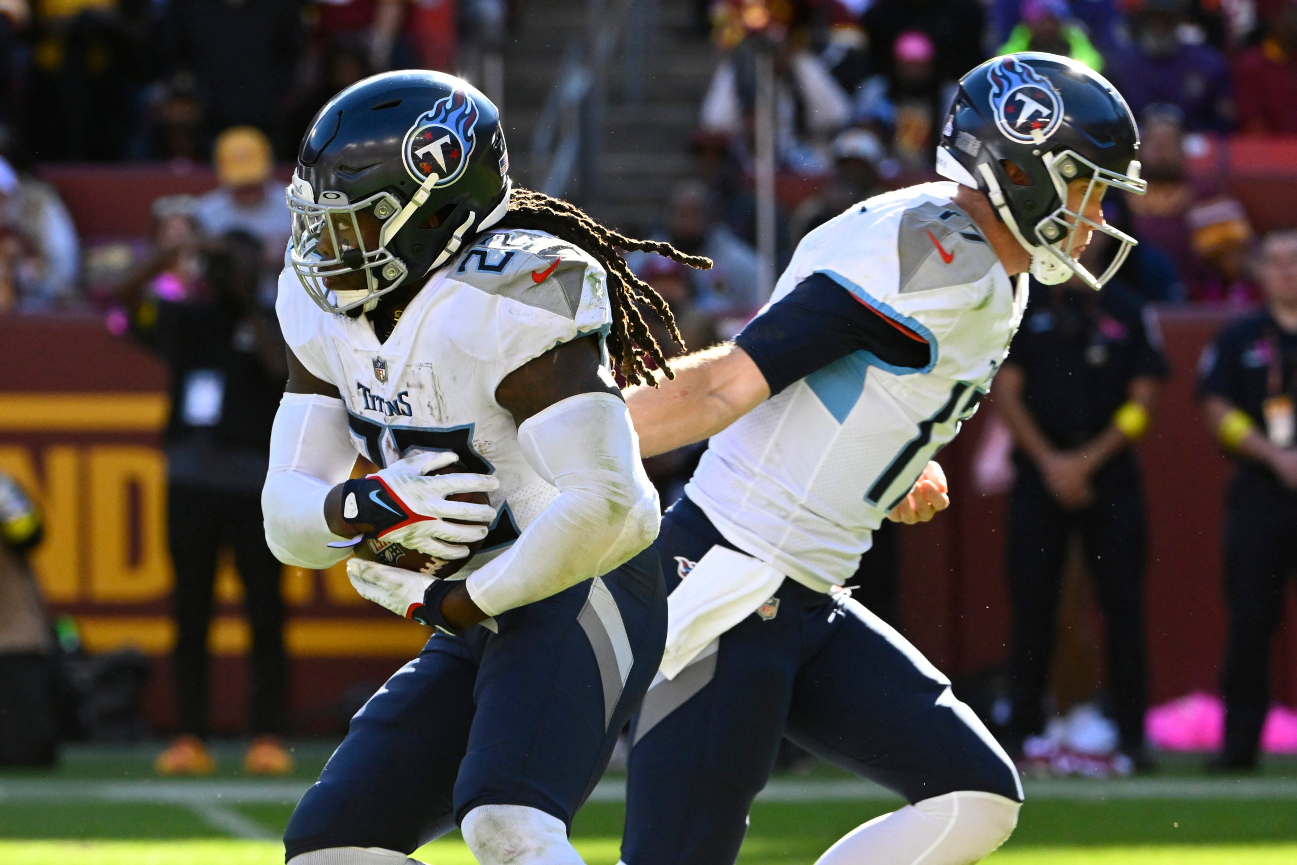 Oct 9, 2022; Landover, Maryland, USA; /t 17/ hands the ball off to running back Derrick Henry (22) against the Washington Commanders during the second half at FedExField. Mandatory Credit: Brad Mills-USA TODAY Sports