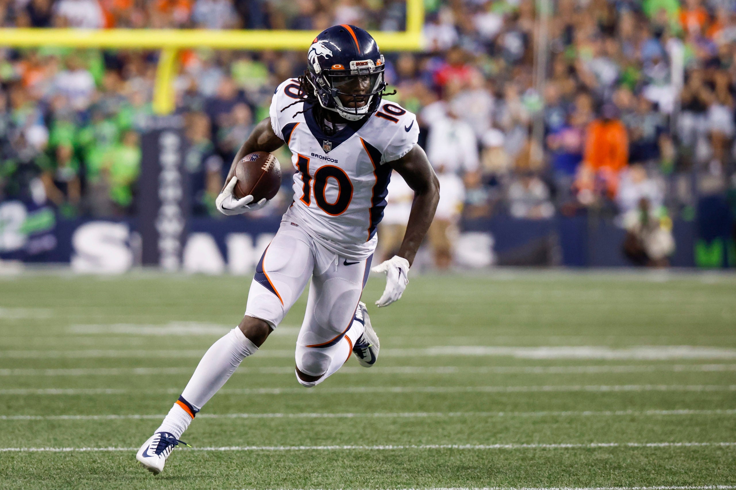 Sep 12, 2022; Seattle, Washington, USA; Denver Broncos wide receiver Jerry Jeudy (10) runs for yards after the catch against the Seattle Seahawks during the fourth quarter at Lumen Field. Mandatory Credit: Joe Nicholson-USA TODAY Sports