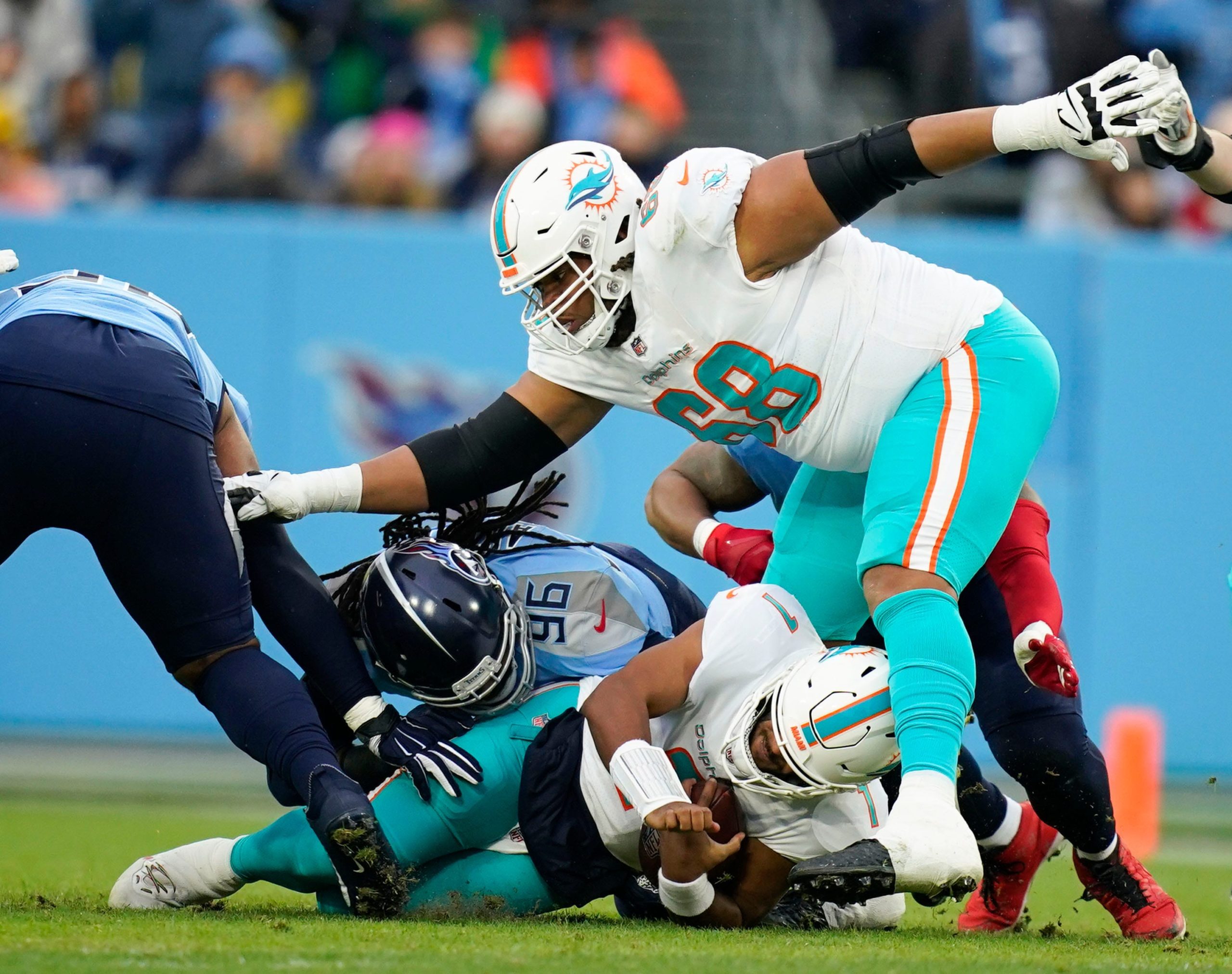 Tennessee Titans defensive end Denico Autry (96) sacks Miami Dolphins quarterback Tua Tagovailoa (1) during the first quarter at Nissan Stadium Sunday, Jan. 2, 2022 in Nashville, Tenn. Titans Dolphins 036 Syndication The Tennessean