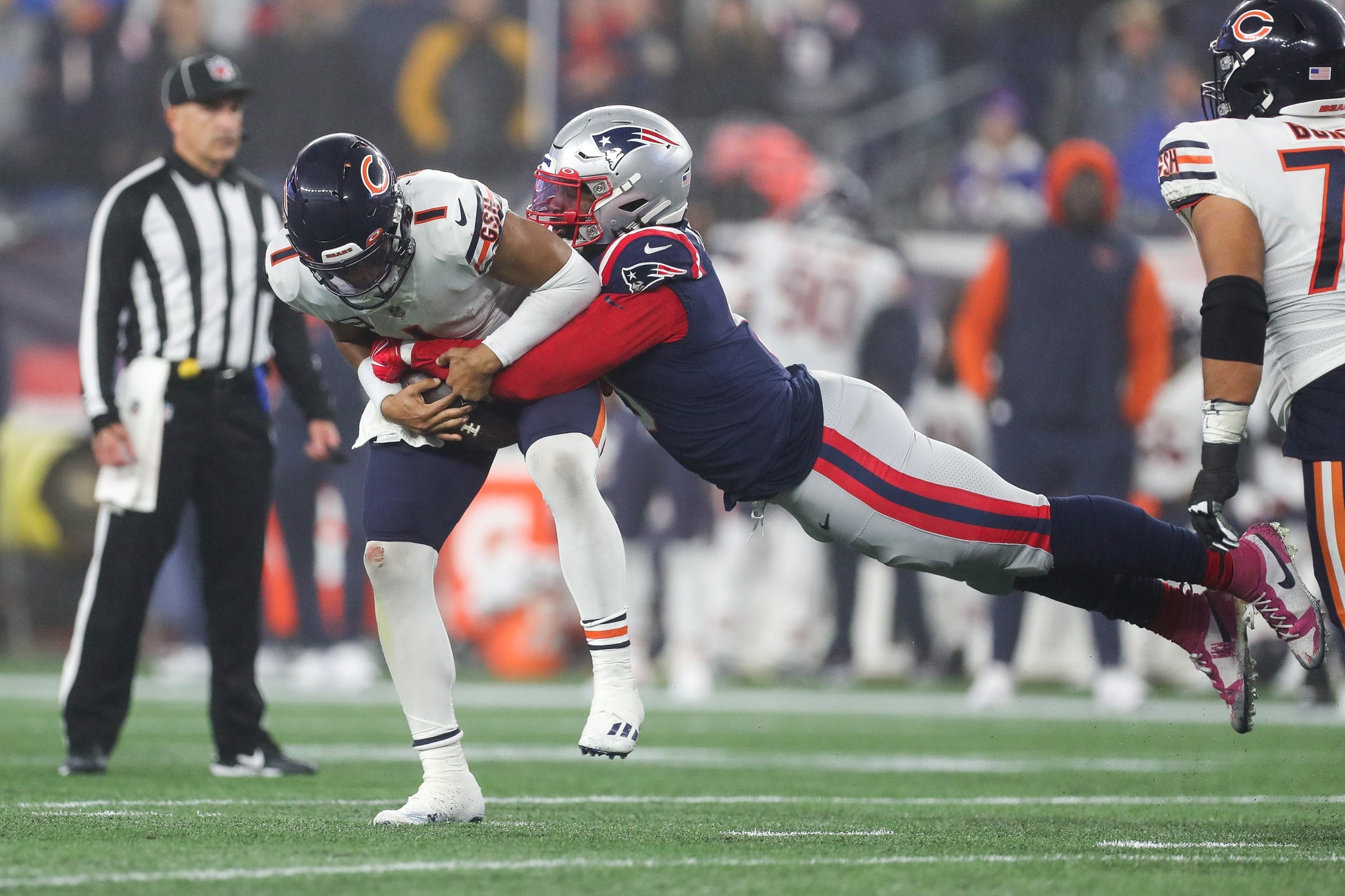 Oct 24, 2022; Foxborough, Massachusetts, USA; New England Patriots outside linebacker Matt Judon (9) sacks Chicago Bears quarterback Justin Fields (1) during the first half at Gillette Stadium. Mandatory Credit: Paul Rutherford-USA TODAY Sports