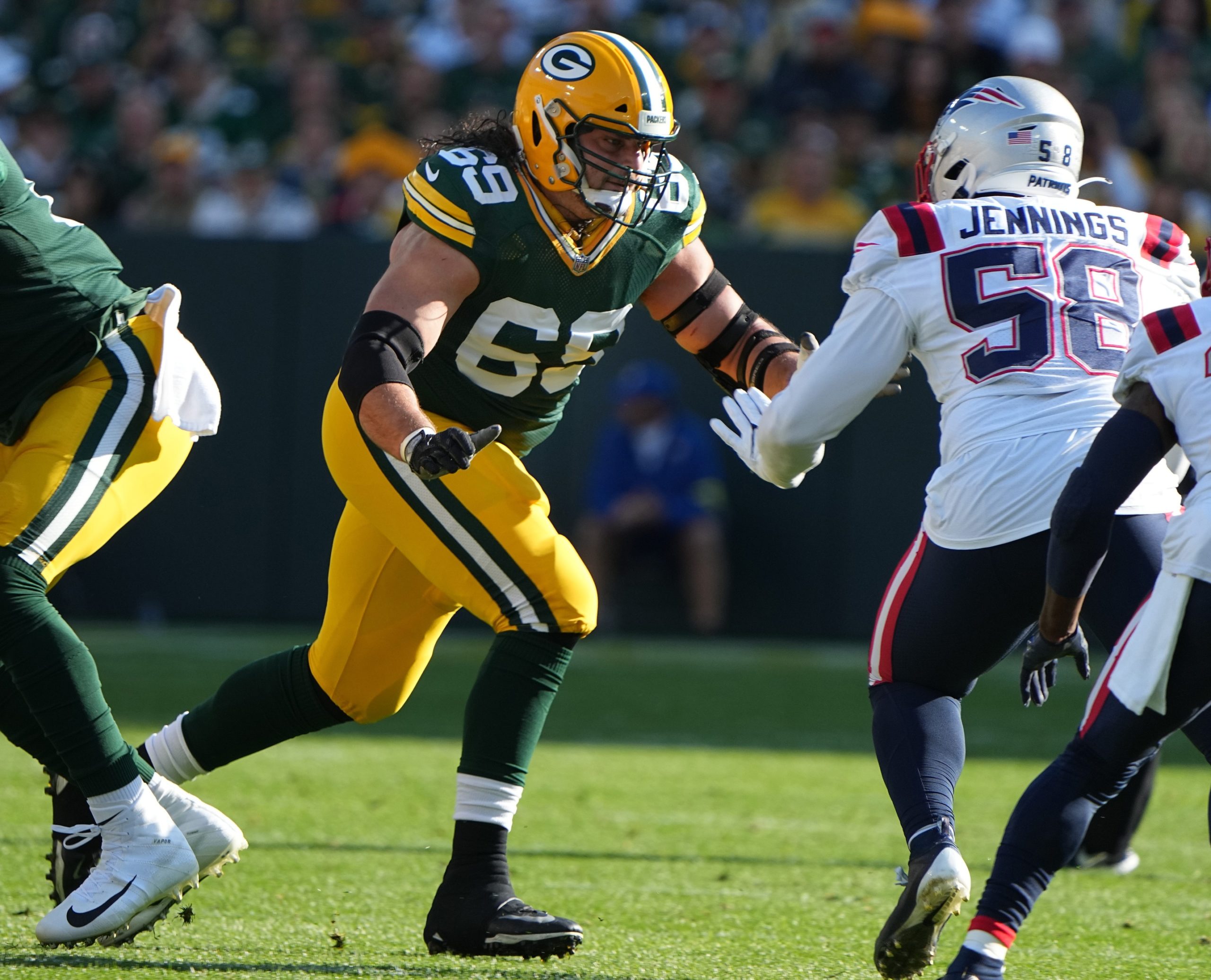 Green Bay Packers' David Bakhtiari (69) looks to Blok New England Patriots linebacker Anfernee Jennings (58) during the first quarter of their game Sunday, October 2, 2022 at Lambeau Field in Green Bay, Wis. Mandatory Credit: MARK HOFFMAN/MILWAUKEE JOURNAL SENTINEL-USA TODAY NETWORK