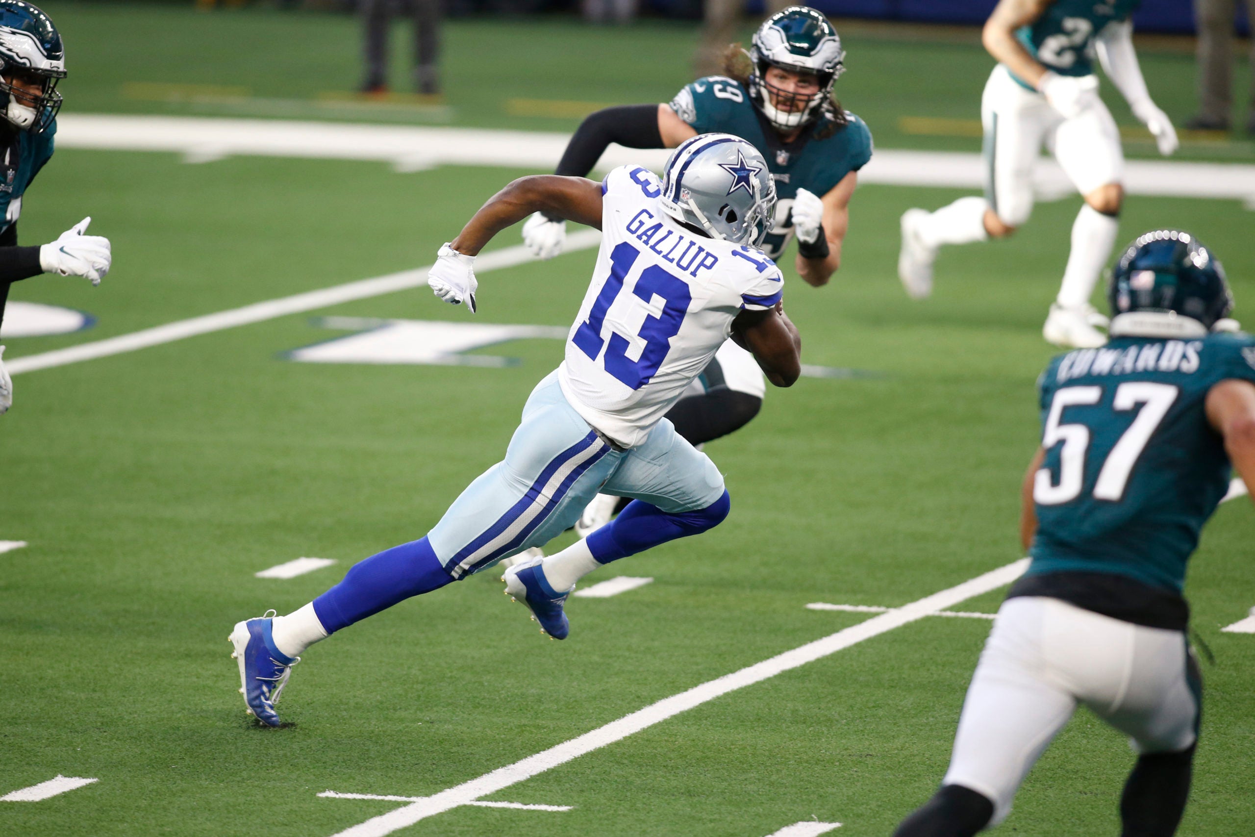Dec 27, 2020; Arlington, Texas, USA; Dallas Cowboys wide receiver Michael Gallup (13) runs for a touchdown after catching a pass against the Philadelphia Eagles in the second quarter at AT&T Stadium. Mandatory Credit: Tim Heitman-USA TODAY Sports