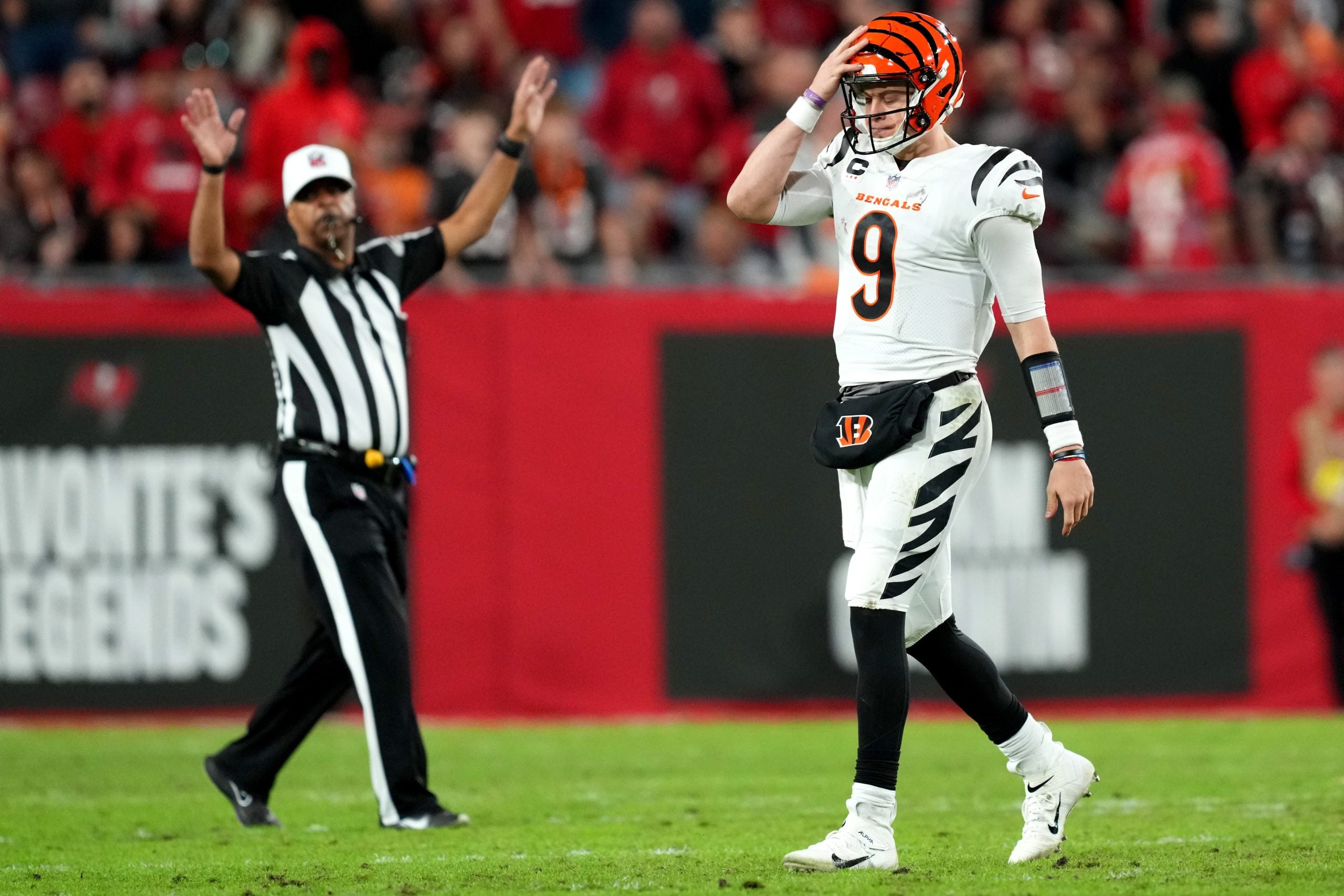 Cincinnati Bengals quarterback Joe Burrow (9) reacts after taking a timeout in the fourth quarter during a Week 15 NFL game against the Tampa Bay Buccaneers, Sunday, Dec. 18, 2022, at Raymond James Stadium in Tampa, Fla. The Cincinnati Bengals won, 34-23. The Cincinnati Bengals improved to 10-4 on the season. Nfl Cincinnati Bengals At Tampa Bay Buccaneers Dec 18 0244