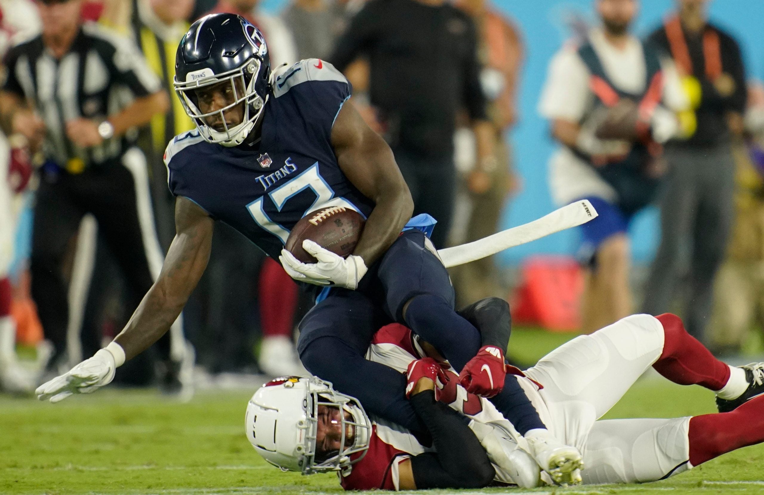 Tennessee Titans wide receiver Racey McMath (13) is tackled by Arizona Cardinals cornerback Jace Whittaker (39) after a catch during the third quarter of an NFL preseason game at Nissan Stadium Saturday, Aug. 27, 2022, in Nashville, Tenn. Syndication The Tennessean