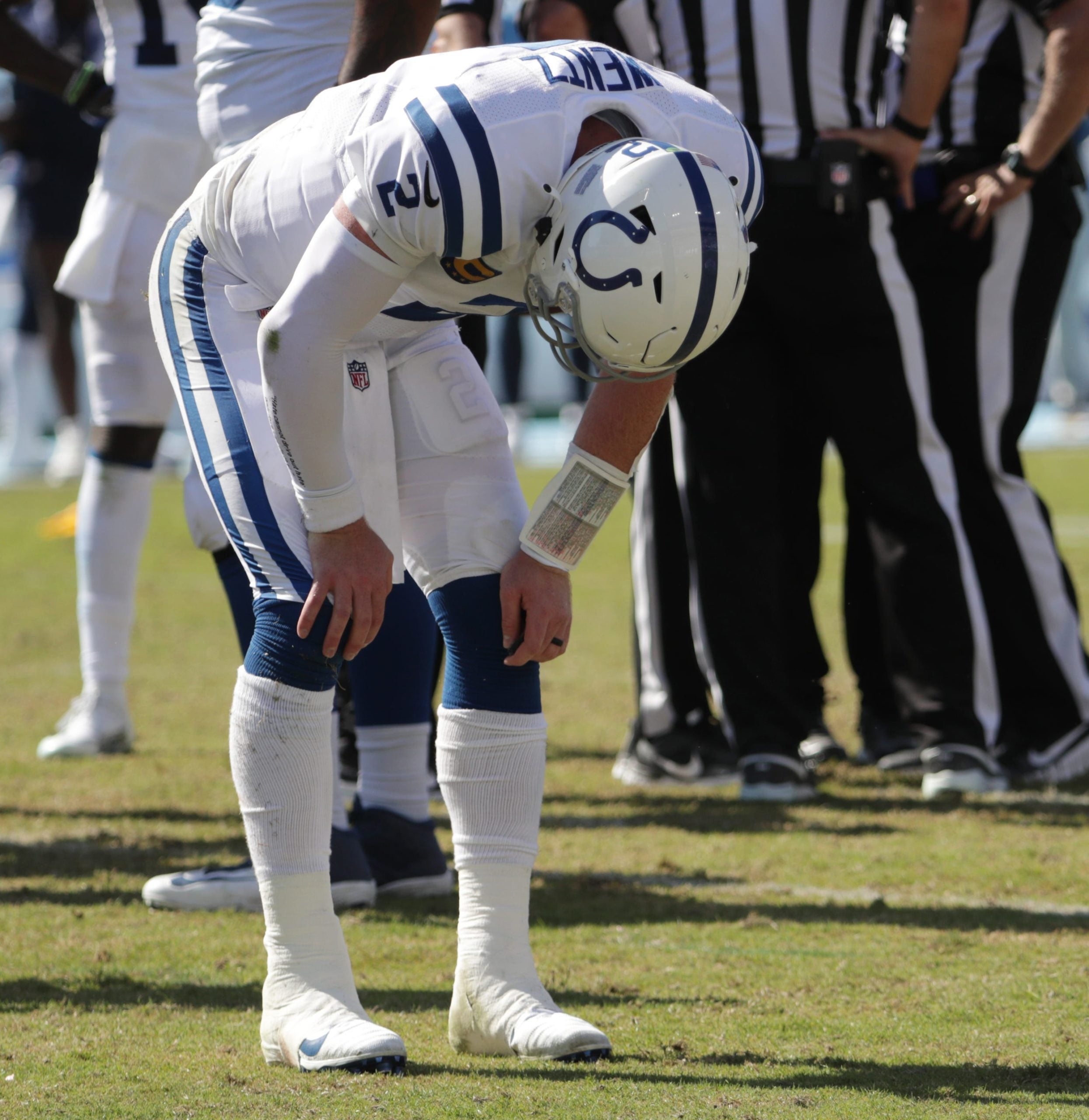 Carson Wentz leans over after take a hit during the second half of a 16-25 Colts loss on Sunday, Sept. 26, 2021, at Nissan Stadium in Nashville. Indianapolis Colts And Tennessee Titans At Nissan Stadium In Nashville Tenn Sunday Sept 16 2021 In Nfl Week 3