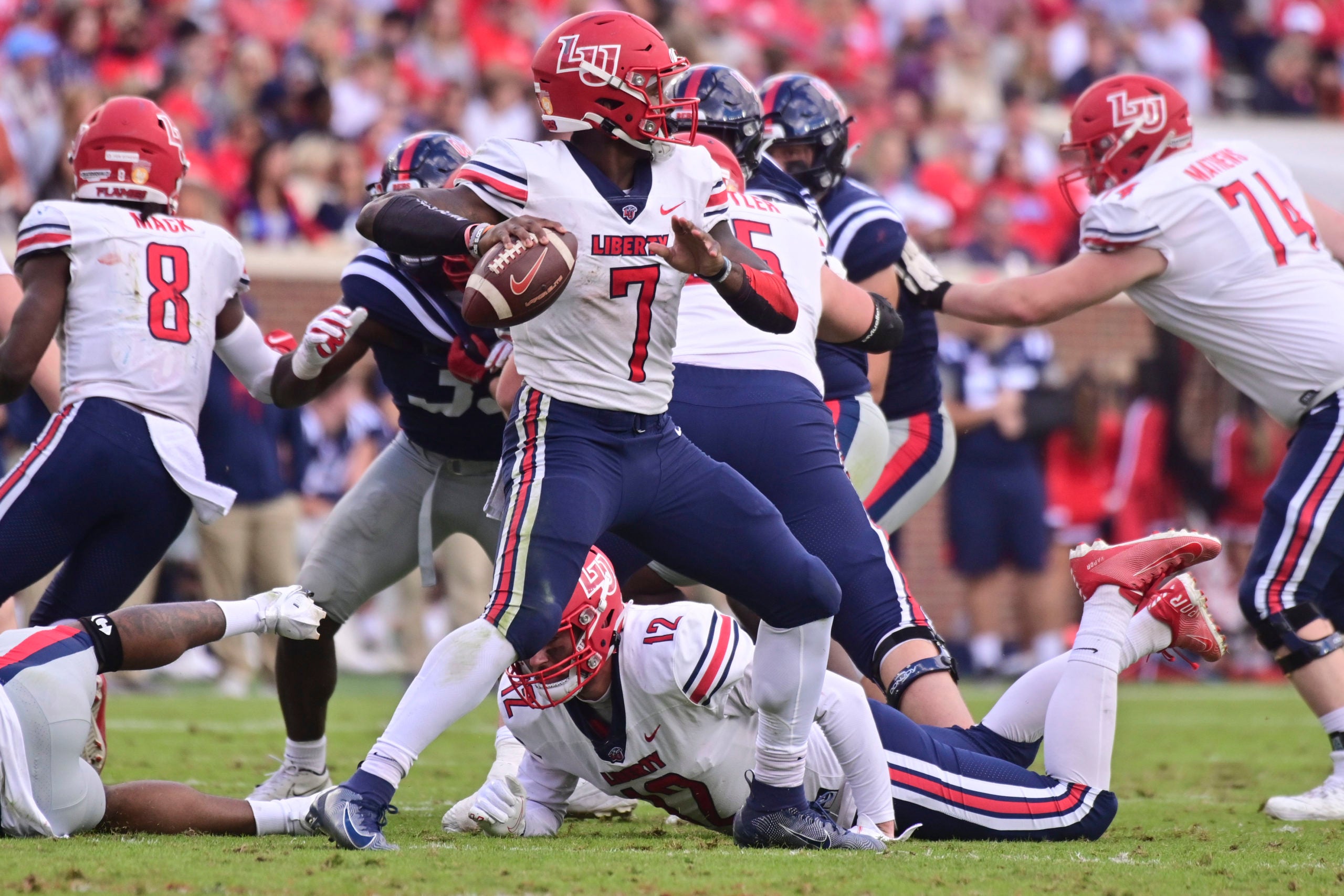 Nov 6, 2021; Oxford, Mississippi, USA; Liberty Flames quarterback Malik Willis (7) looks to pass the ball against the Mississippi Rebels during the second quarter at Vaught-Hemingway Stadium. Mandatory Credit: Matt Bush-USA TODAY Sports