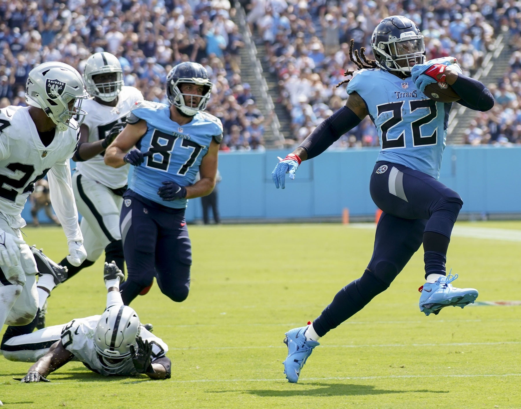 Sep 25, 2022; Nashville, Tennessee, USA; Tennessee Titans running back Derrick Henry (22) gets a first down during the second quarter against the Las Vegas Raiders at Nissan Stadium. Mandatory Credit: George Walker IV-USA TODAY Sports