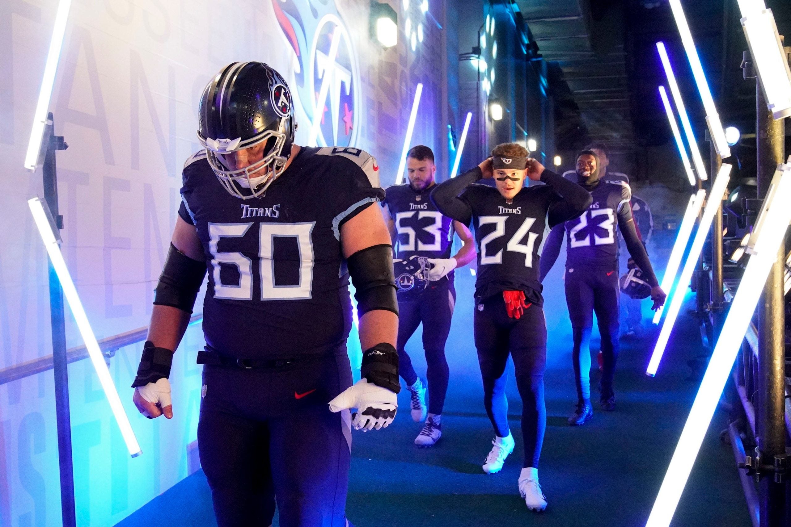 Tennessee Titans center Ben Jones (60) and other teammates head to the field to face the Bengals during the AFC Divisional playoff game at Nissan Stadium Saturday, Jan. 22, 2022 in Nashville, Tenn. Titans Bengals 062