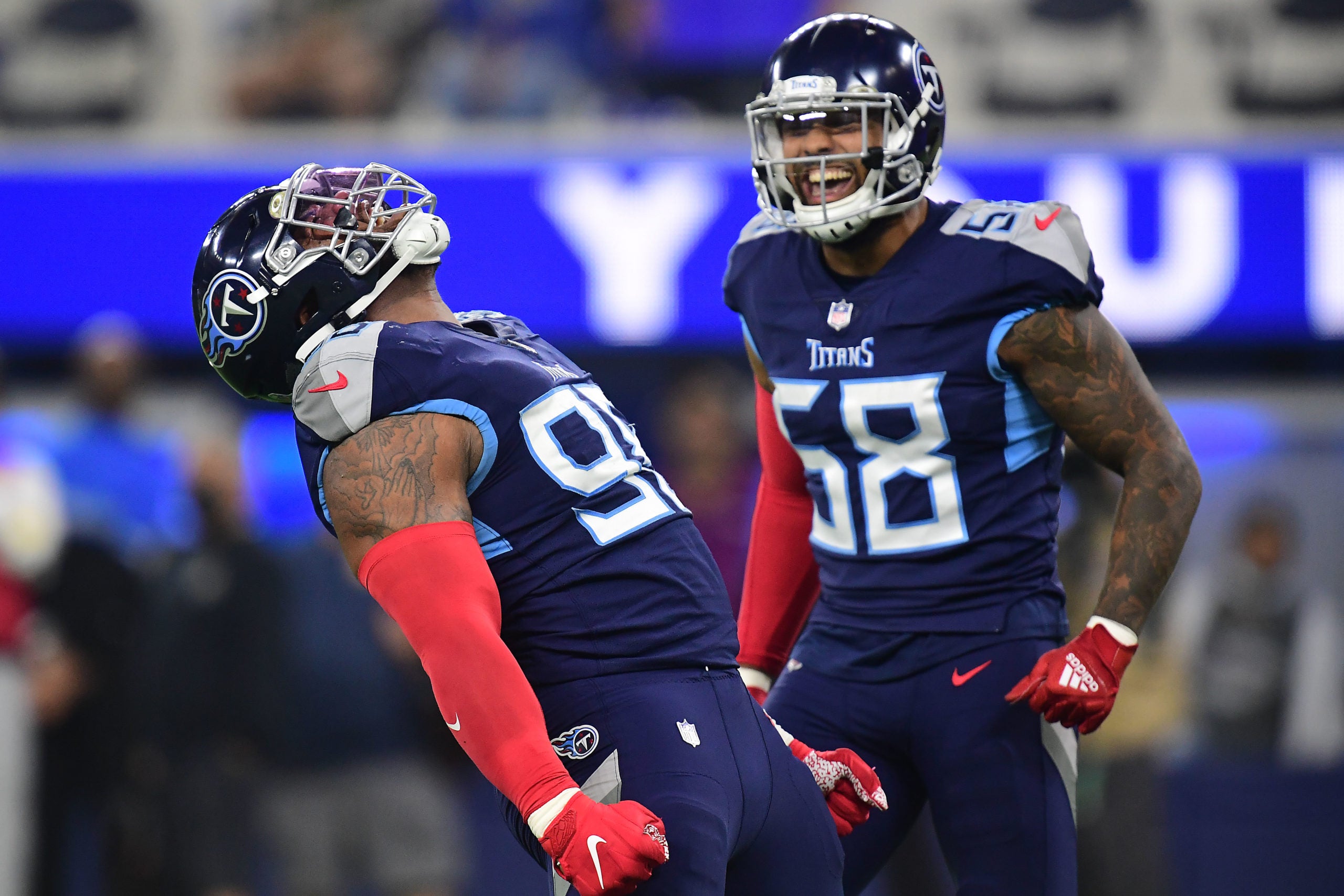 Nov 7, 2021; Inglewood, California, USA; Tennessee Titans defensive end Jeffery Simmons (98) celebrates with outside linebacker Harold Landry (58) after bringing down Los Angeles Rams quarterback Matthew Stafford (9) during the first half at SoFi Stadium. Mandatory Credit: Gary A. Vasquez-USA TODAY Sports