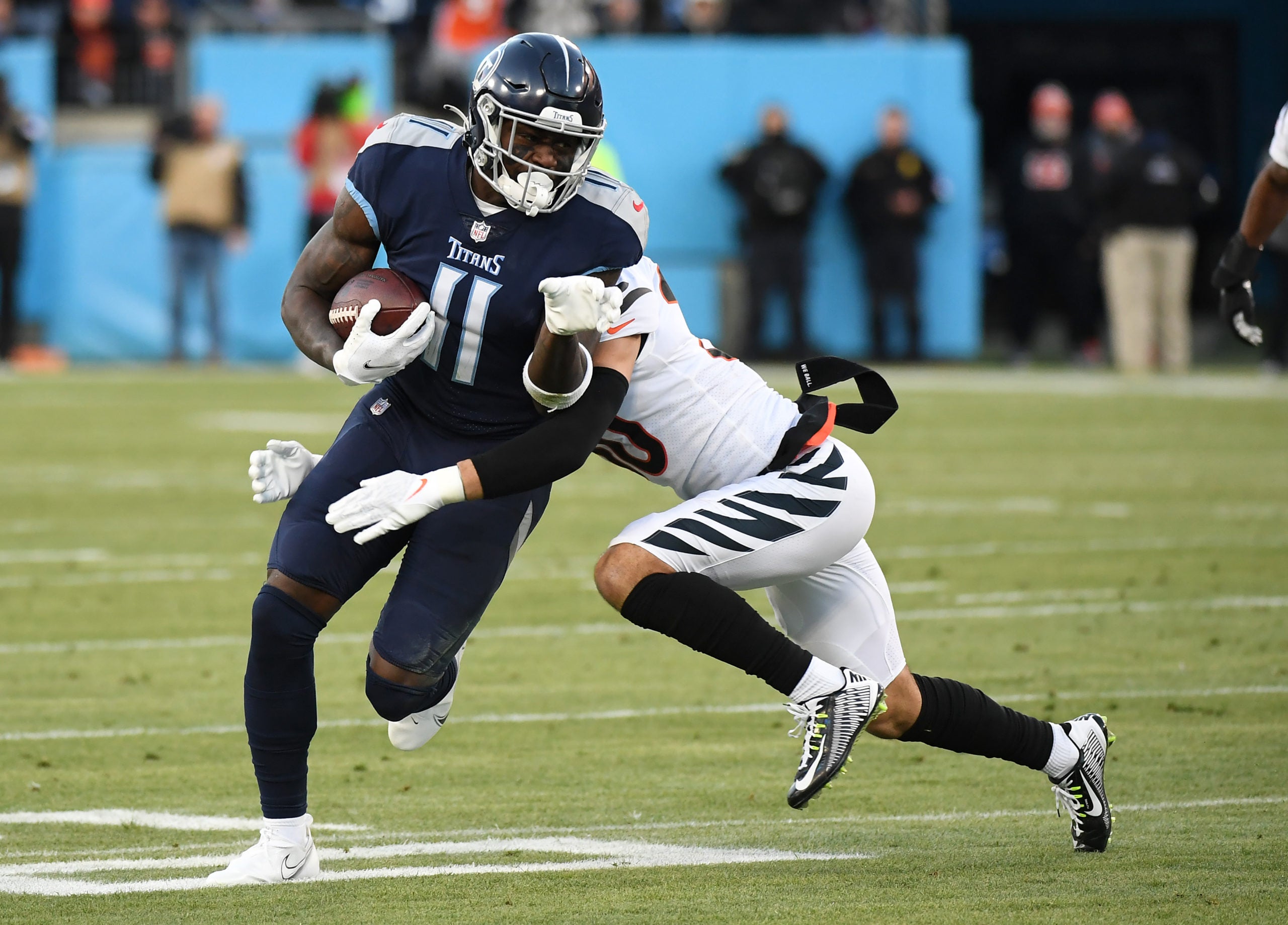 Jan 22, 2022; Nashville, Tennessee, USA; Tennessee Titans wide receiver A.J. Brown (11) runs after a catch during the first half of an AFC Divisional playoff football game against the Cincinnati Bengals at Nissan Stadium. Mandatory Credit: Christopher Hanewinckel-USA TODAY Sports