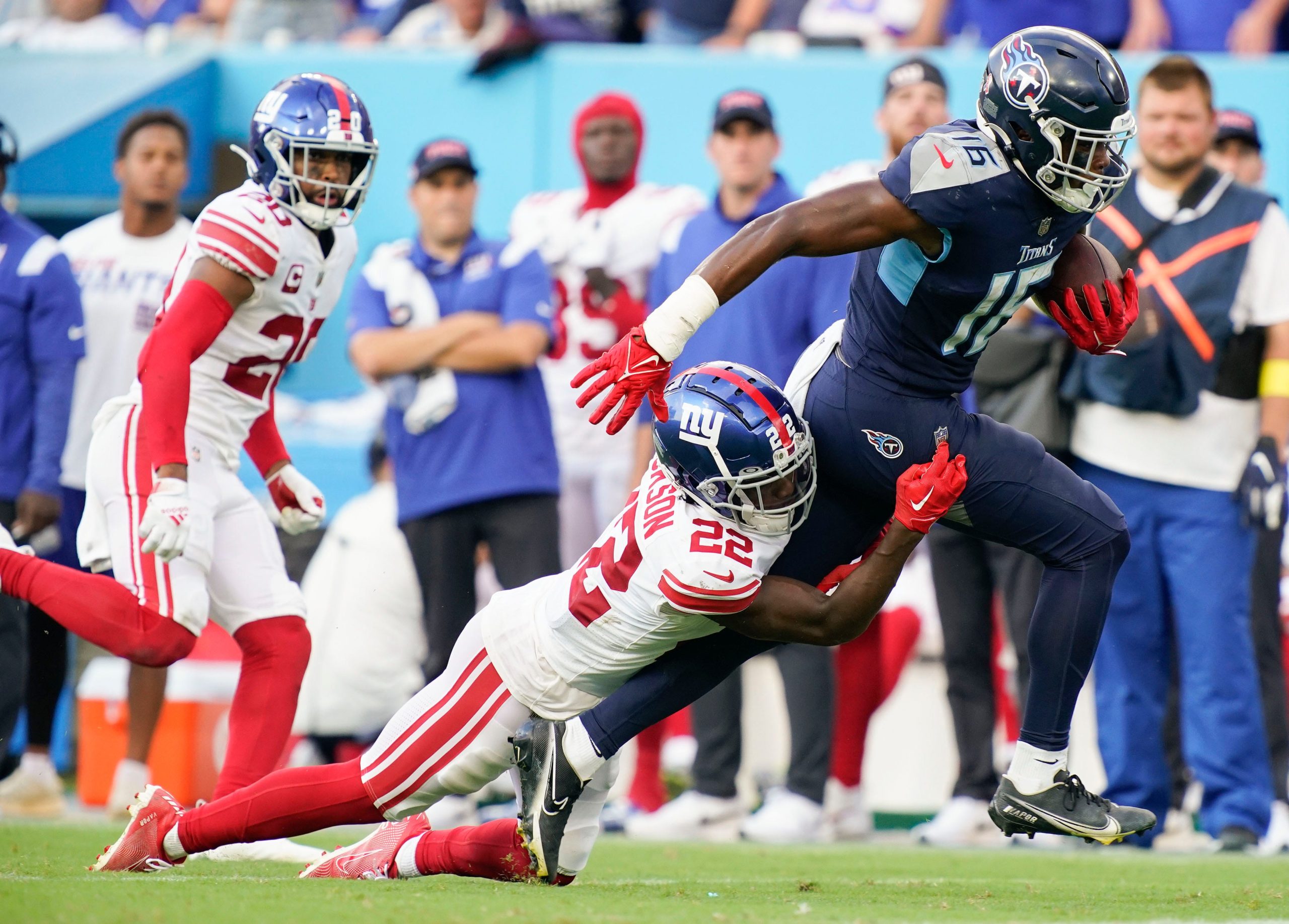 Tennessee Titans wide receiver Treylon Burks (16) picks up a first down as New York Giants cornerback Adoree' Jackson (22) tries to tackle him during the third quarter at Nissan Stadium Sunday, Sept. 11, 2022, in Nashville, Tenn. Nfl New York Giants At Tennessee Titans