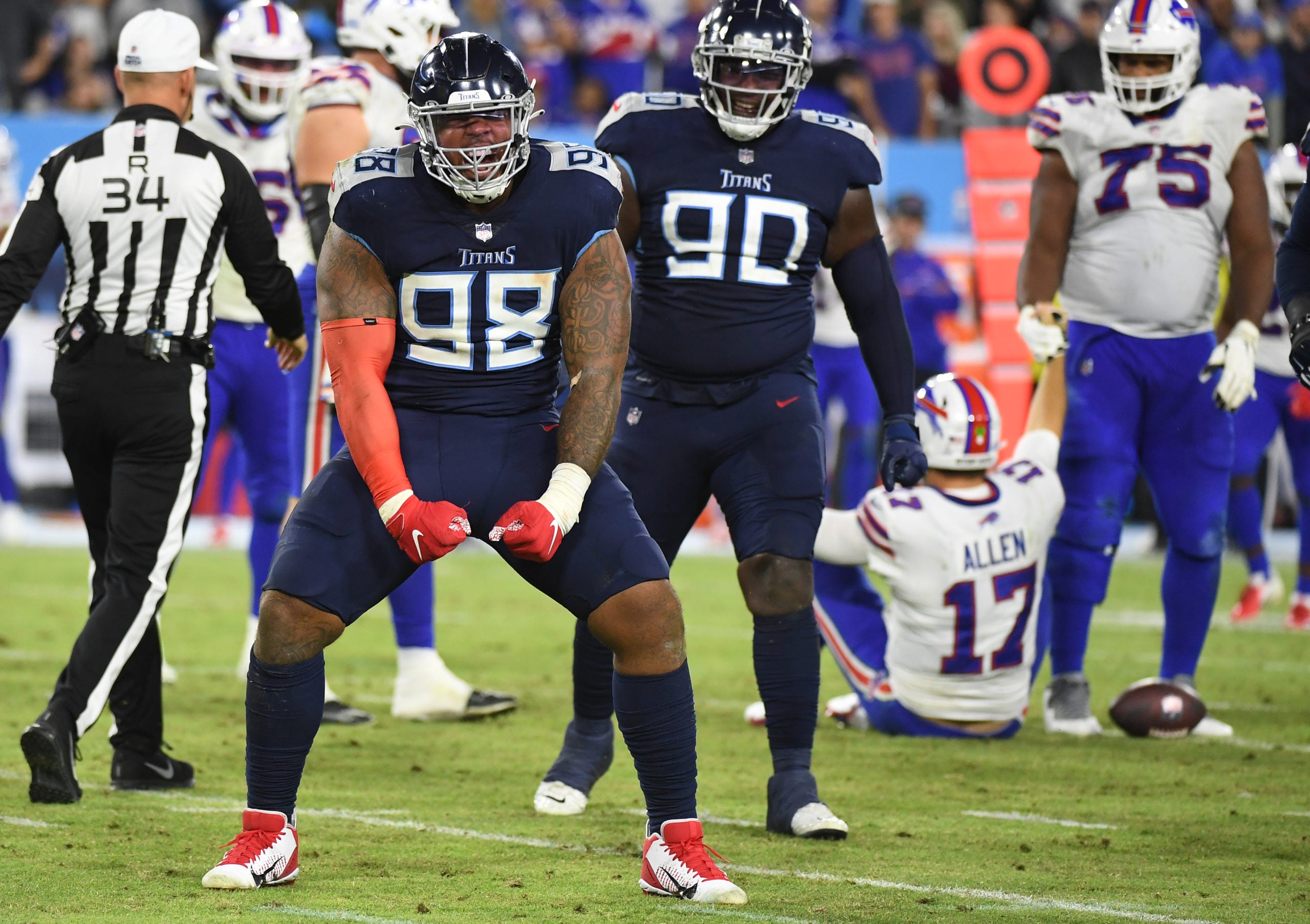 Oct 18, 2021; Nashville, Tennessee, USA; Tennessee Titans defensive end Jeffery Simmons (98) after sacking Buffalo Bills quarterback Josh Allen (17) during the second half at Nissan Stadium. Mandatory Credit: Christopher Hanewinckel-USA TODAY Sports
