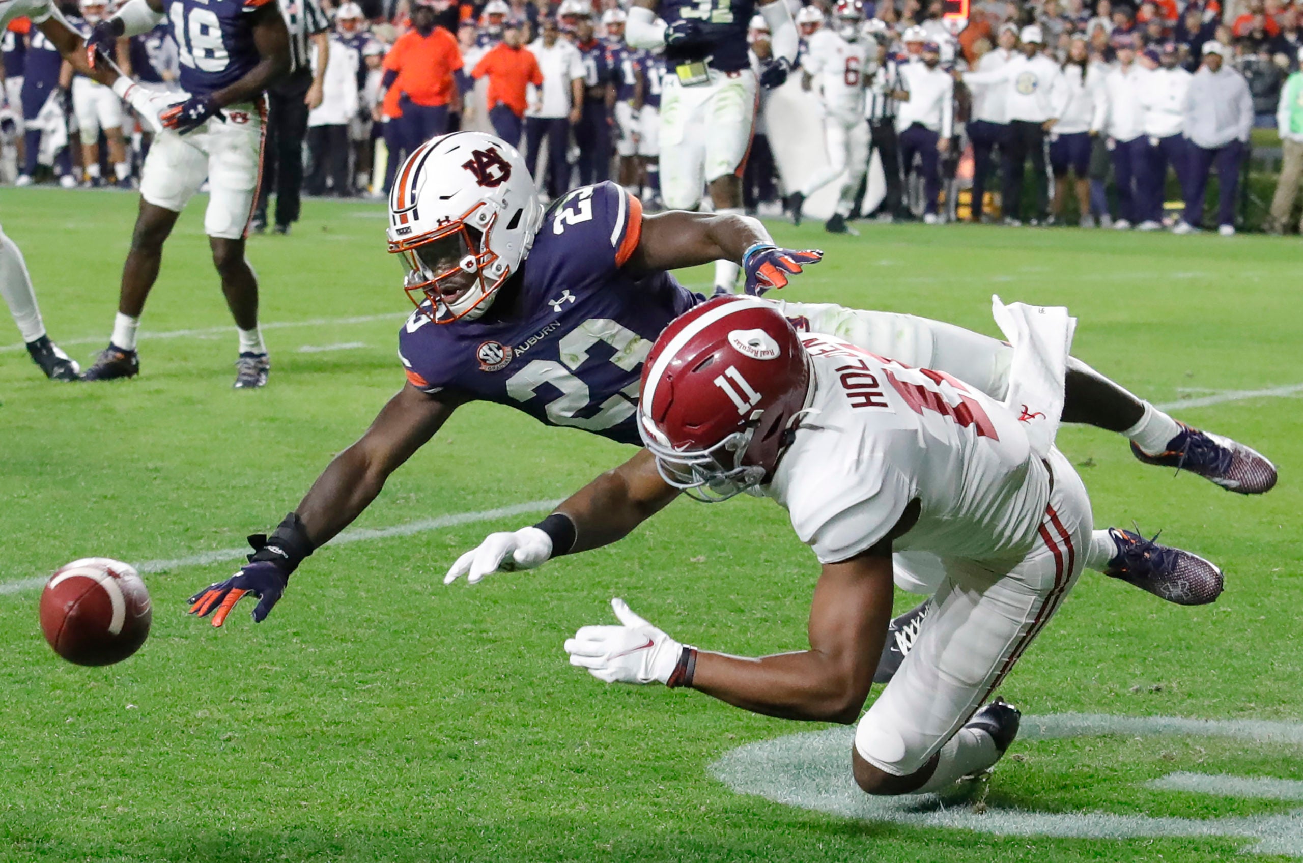 Nov 27, 2021; Auburn, Alabama, USA; Auburn Tigers cornerback Roger McCreary (23) breaks up a pass intended for Alabama Crimson Tide wide receiver Traeshon Holden (11) during the third quarter at Jordan-Hare Stadium.  Mandatory Credit: John Reed-USA TODAY Sports