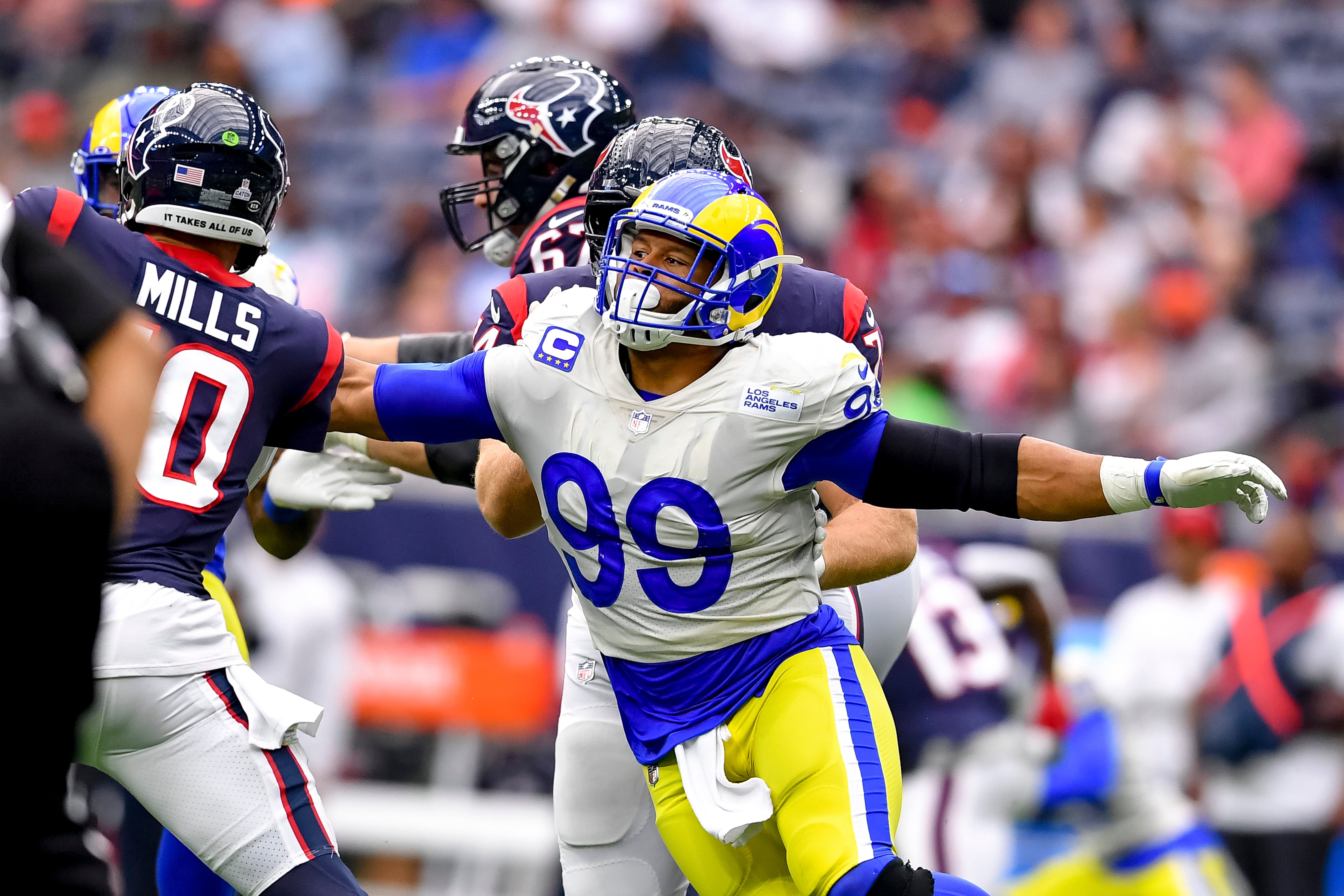 Oct 31, 2021; Houston, Texas, USA; Los Angeles Rams defensive end Aaron Donald (99) pressures Houston Texans quarterback Davis Mills (10) during the fourth quarter at NRG Stadium. Mandatory Credit: Maria Lysaker-USA TODAY Sports