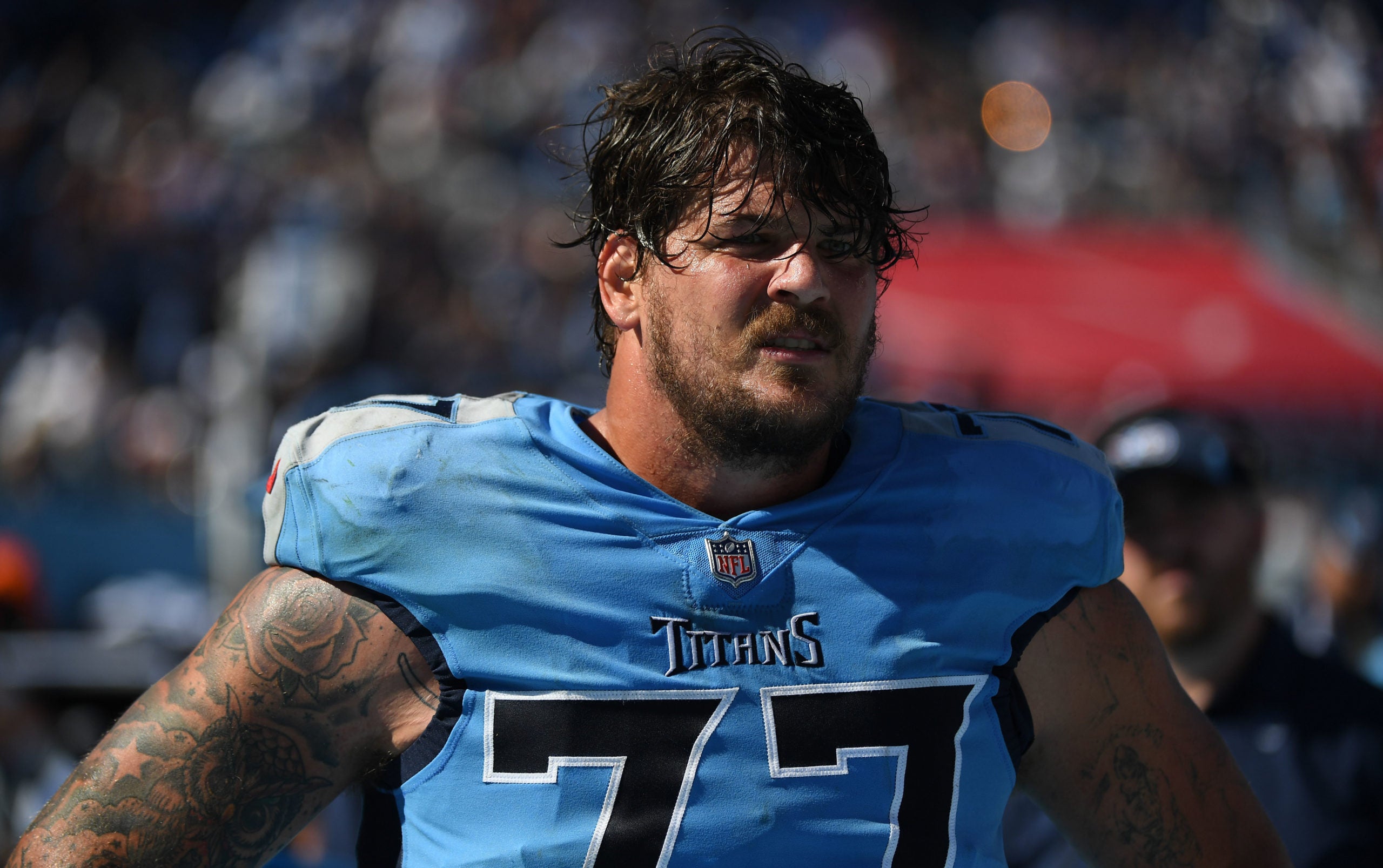 Sep 26, 2021; Nashville, Tennessee, USA; Tennessee Titans offensive tackle Taylor Lewan (77) on the sideline during the second half against the Indianapolis Colts at Nissan Stadium. Mandatory Credit: Christopher Hanewinckel-USA TODAY Sports