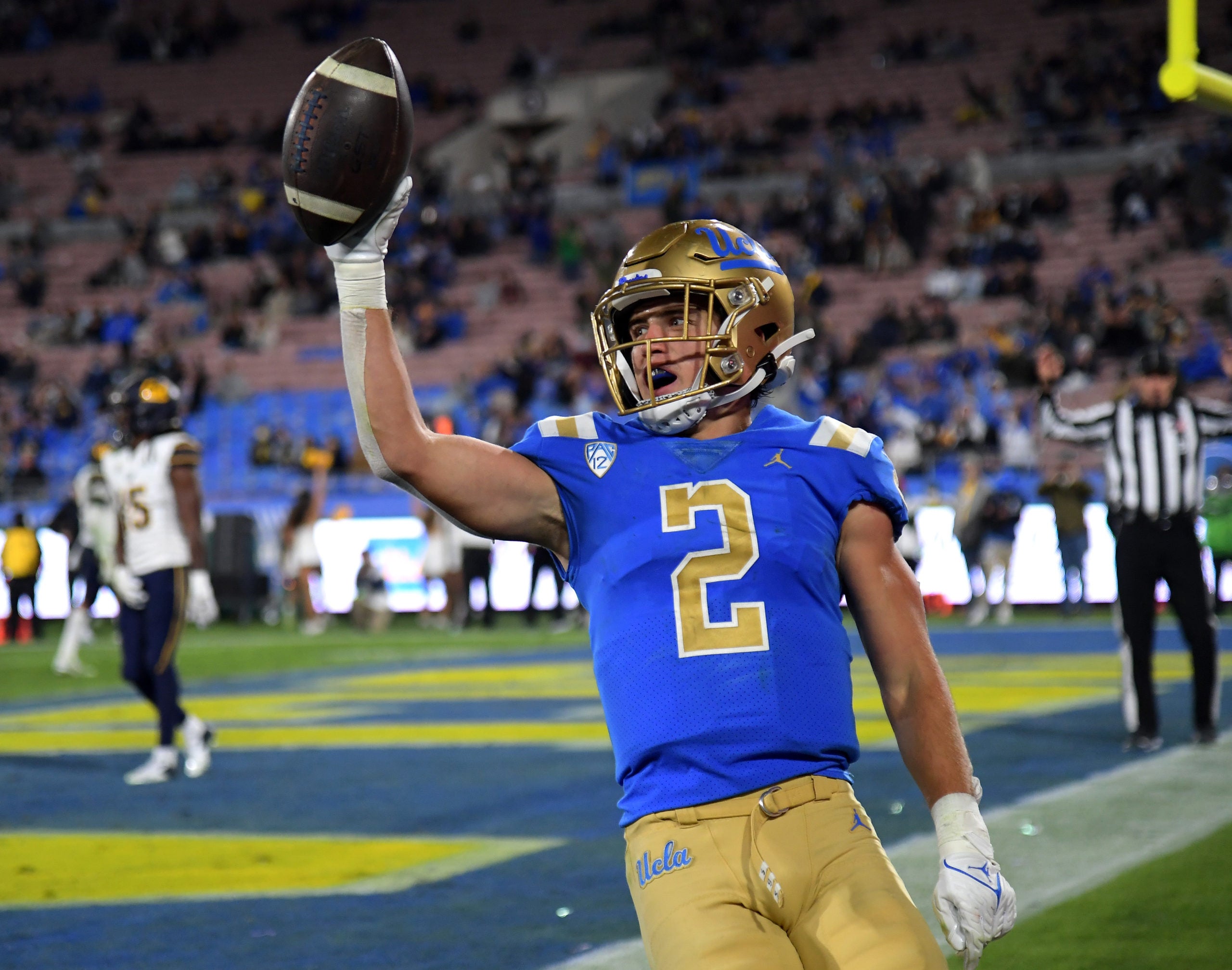 Nov 27, 2021; Pasadena, California, USA;    UCLA Bruins wide receiver Kyle Philips (2) celebrates after catching a touchdown pass against the California Golden Bears in the second half at the Rose Bowl. Mandatory Credit: Jayne Kamin-Oncea-USA TODAY Sports