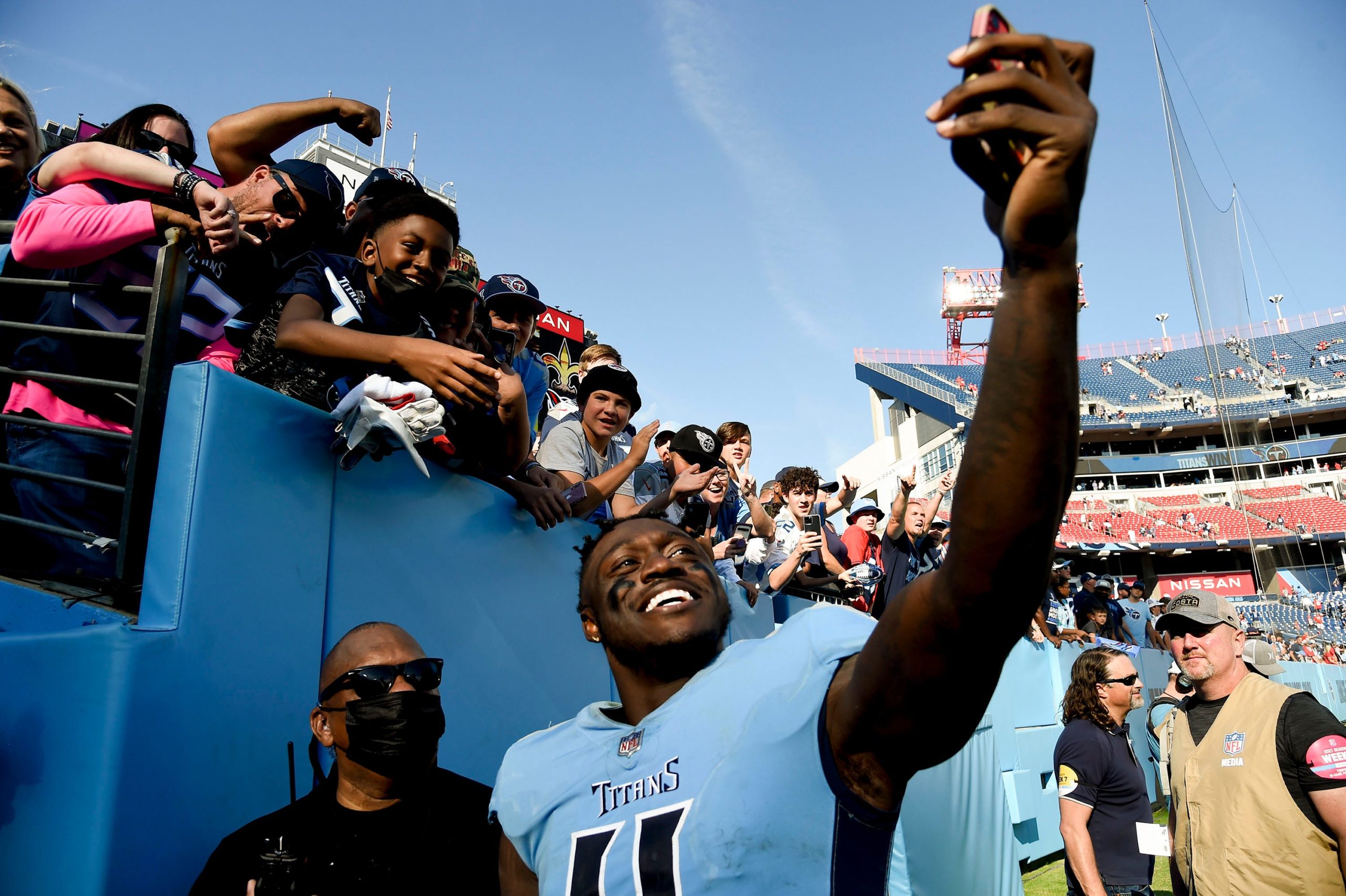 Tennessee Titans wide receiver A.J. Brown (11) takes a selfie with fans after beating the Chiefs at Nissan Stadium Sunday, Oct. 24, 2021 in Nashville, Tenn. Titans Chiefs 195