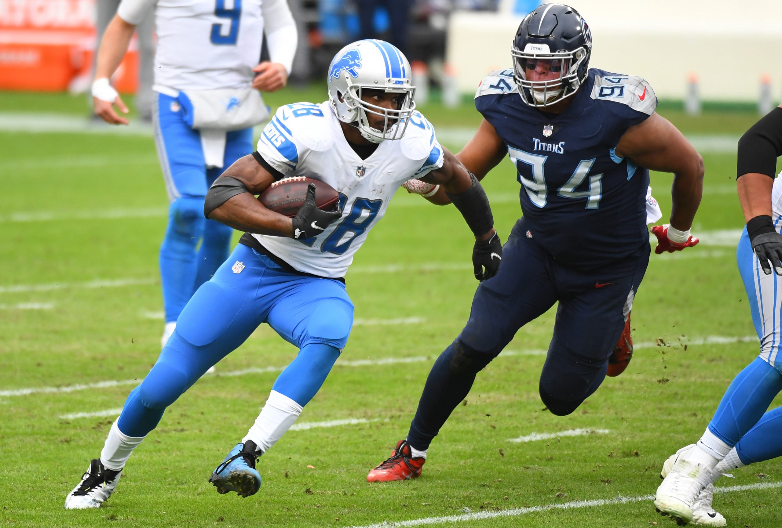 Dec 20, 2020; Nashville, Tennessee, USA; Detroit Lions running back Adrian Peterson (28) runs for a short gain during the first half against the Tennessee Titans at Nissan Stadium. Mandatory Credit: Christopher Hanewinckel-USA TODAY Sports