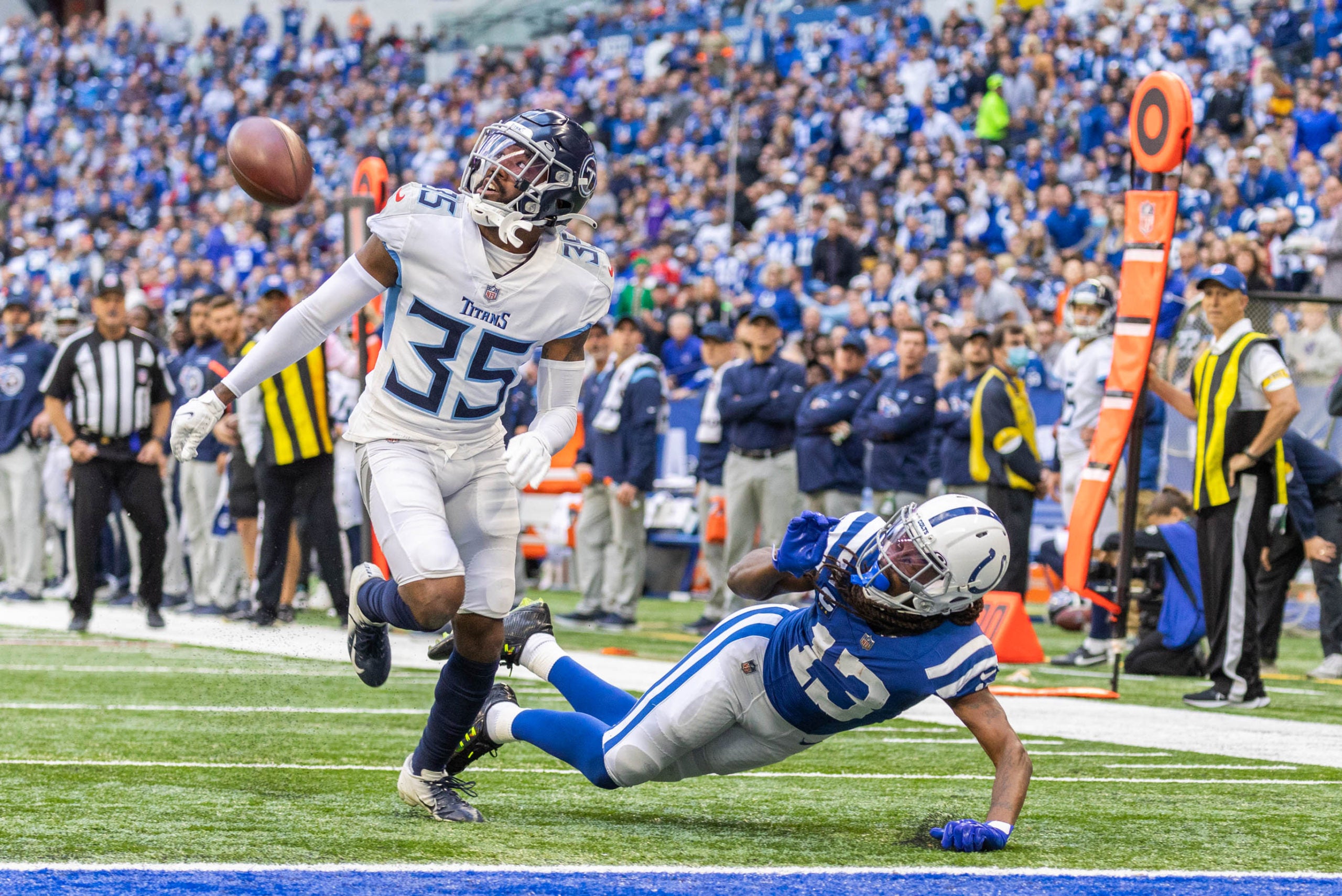 Oct 31, 2021; Indianapolis, Indiana, USA; Indianapolis Colts wide receiver T.Y. Hilton (13) falls while a pass is thrown to him as Tennessee Titans defensive back Chris Jackson (35) defends in the second quarter at Lucas Oil Stadium. Mandatory Credit: Trevor Ruszkowski-USA TODAY Sports